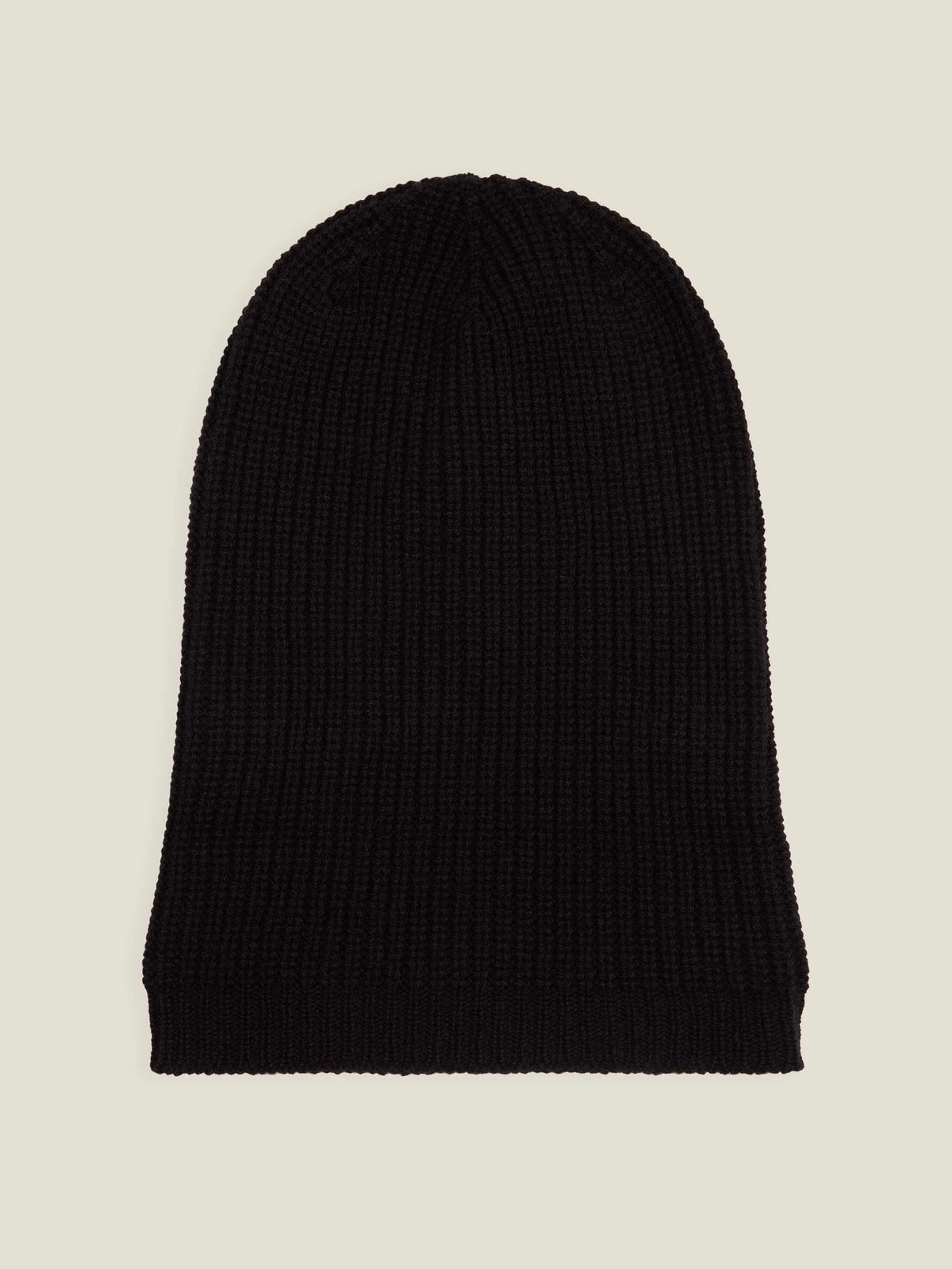 Luca Faloni's black chunky knit cashmere beanie laid flat, highlighting its fine ribbed texture and generous length.