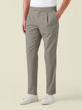Side view of a model wearing the Camel Beige Lightweight Wool Trousers, showcasing the front pleat and tapered silhouette.