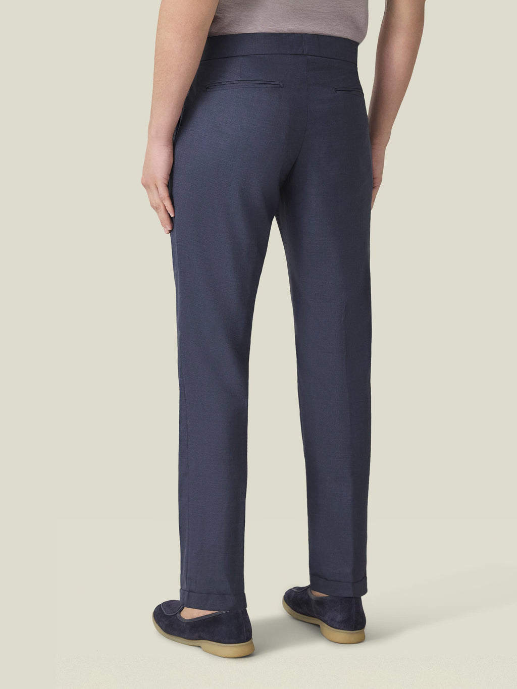 Back view of the Classic Blue Lightweight Wool Trousers, showcasing the tapered fit and cuffed hems.