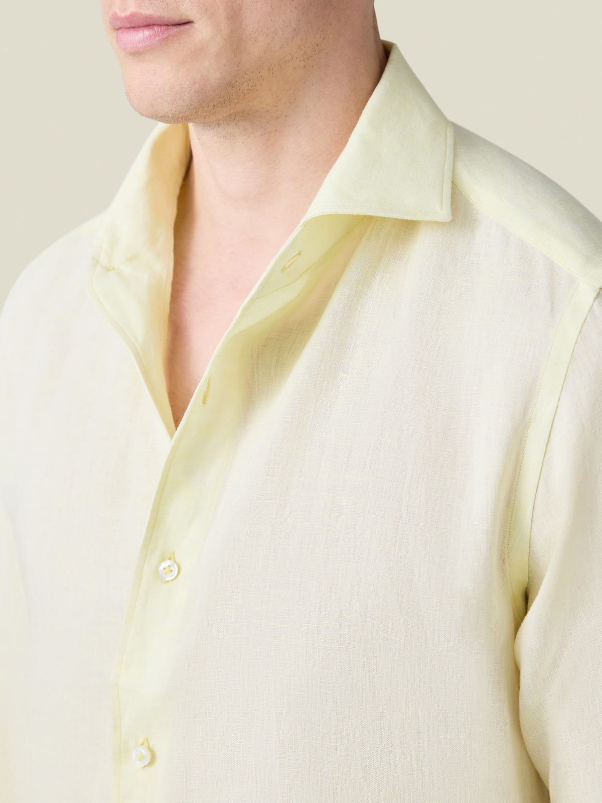 Close-up of a model wearing the Lemon Portofino Linen Shirt, detailing the signature one-piece collar and fine linen fabric.