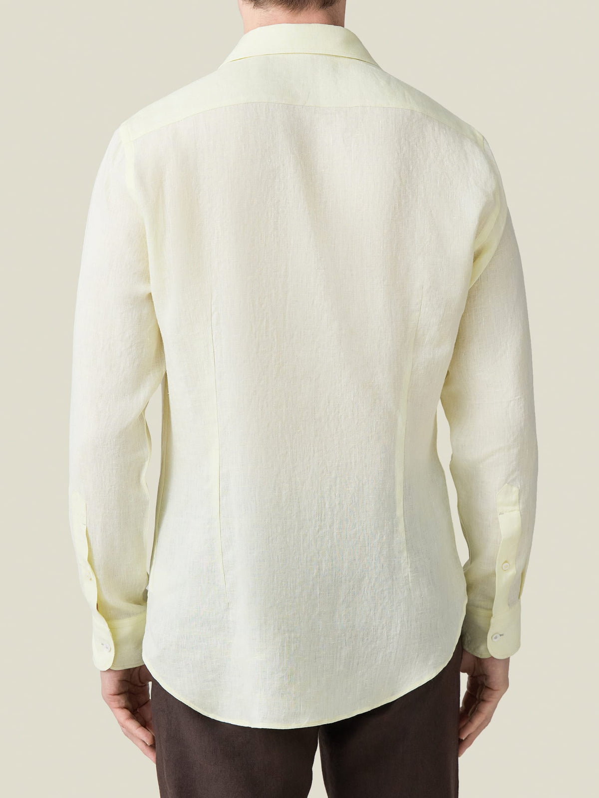 Back view of a model wearing the Portofino Linen Shirt in Lemon.