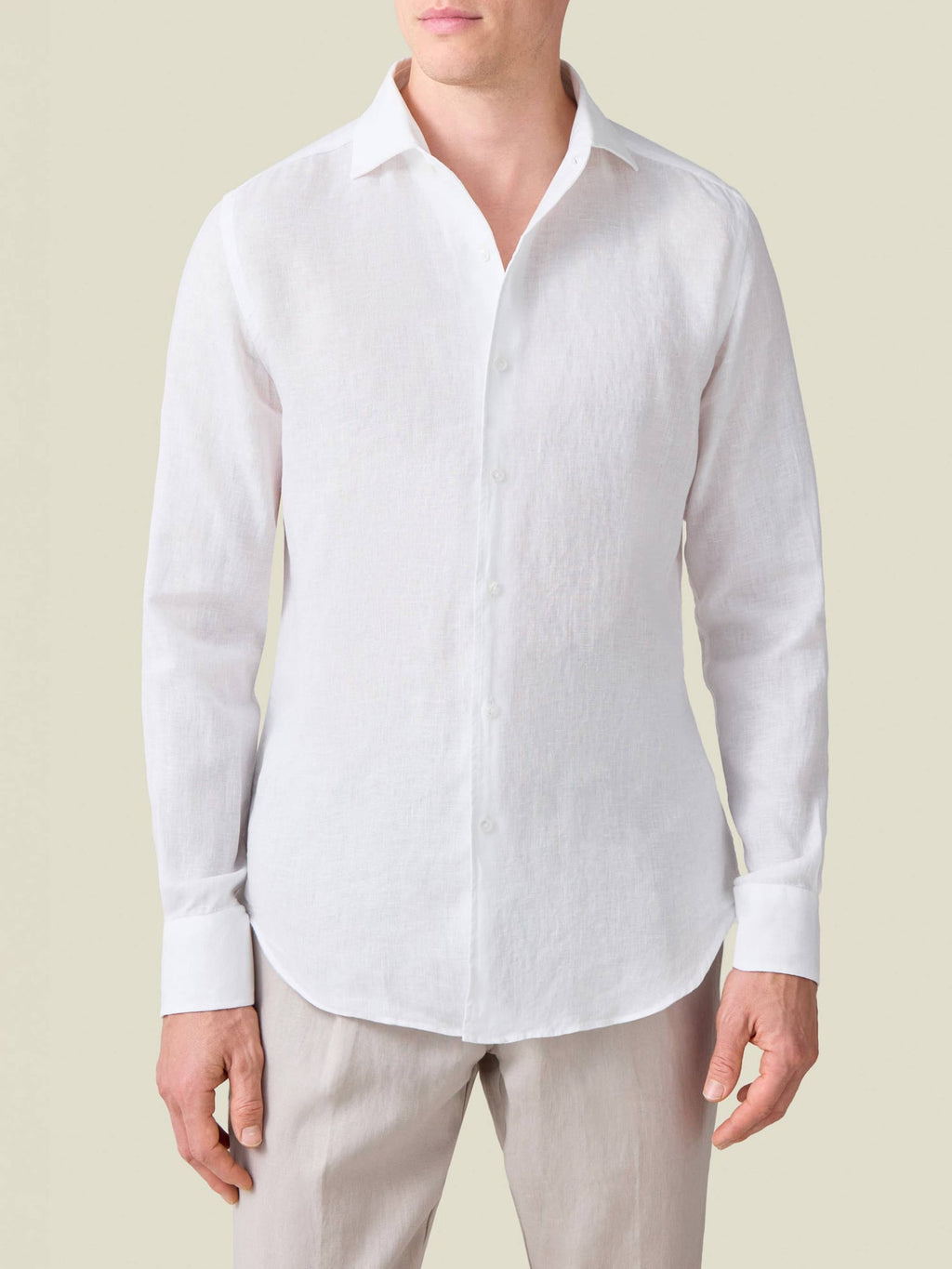 Front view of a model wearing the white Portofino Linen Shirt, highlighting its signature one-piece collar.