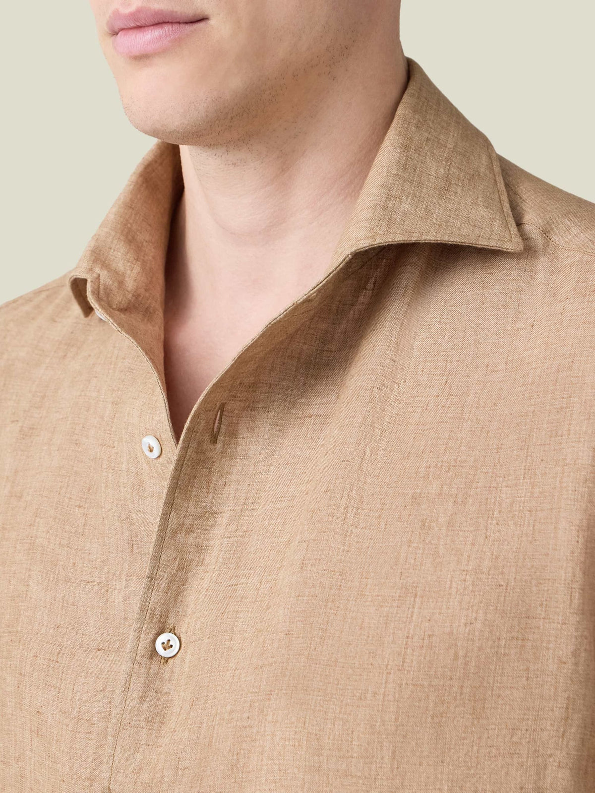 Close-up of the Portofino Linen Shirt in Caramel Brown, showing the signature one-piece collar and fine Italian linen fabric.