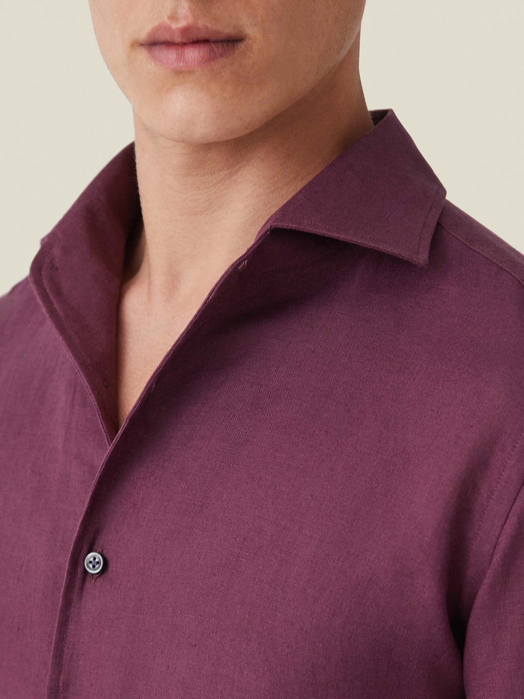 Close-up of the Portofino Linen Shirt in burgundy, showcasing the signature one-piece collar and textured linen fabric.