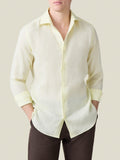Front view of a model wearing the Portofino Linen Shirt in Lemon, with sleeves rolled up and hands in pockets.