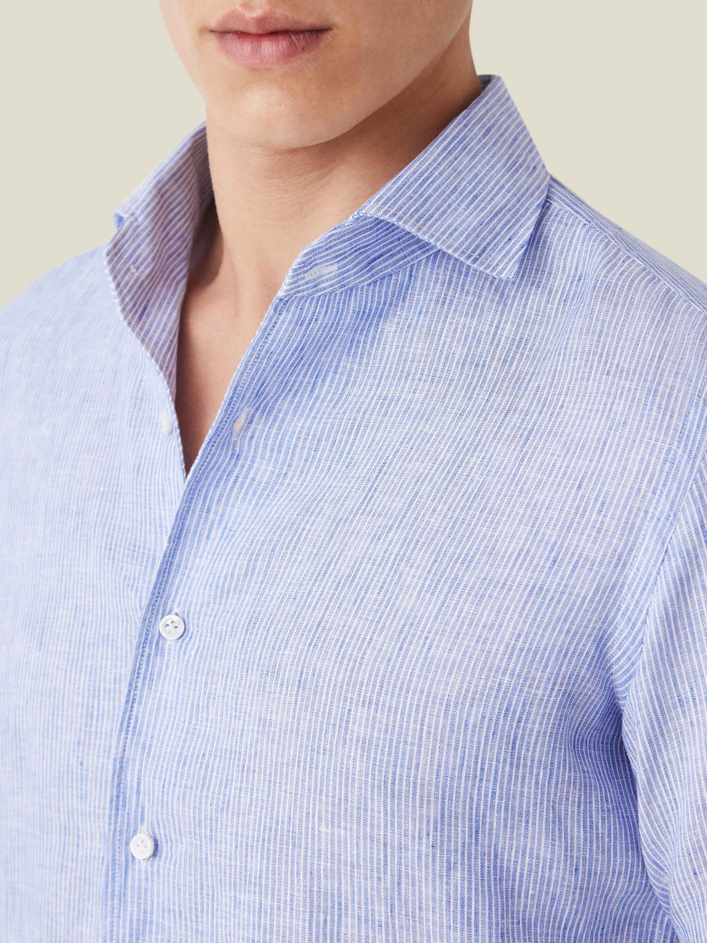 Detail shot of the Portofino Linen Shirt in Striped Classic Blue, highlighting the one-piece collar and fabric texture.