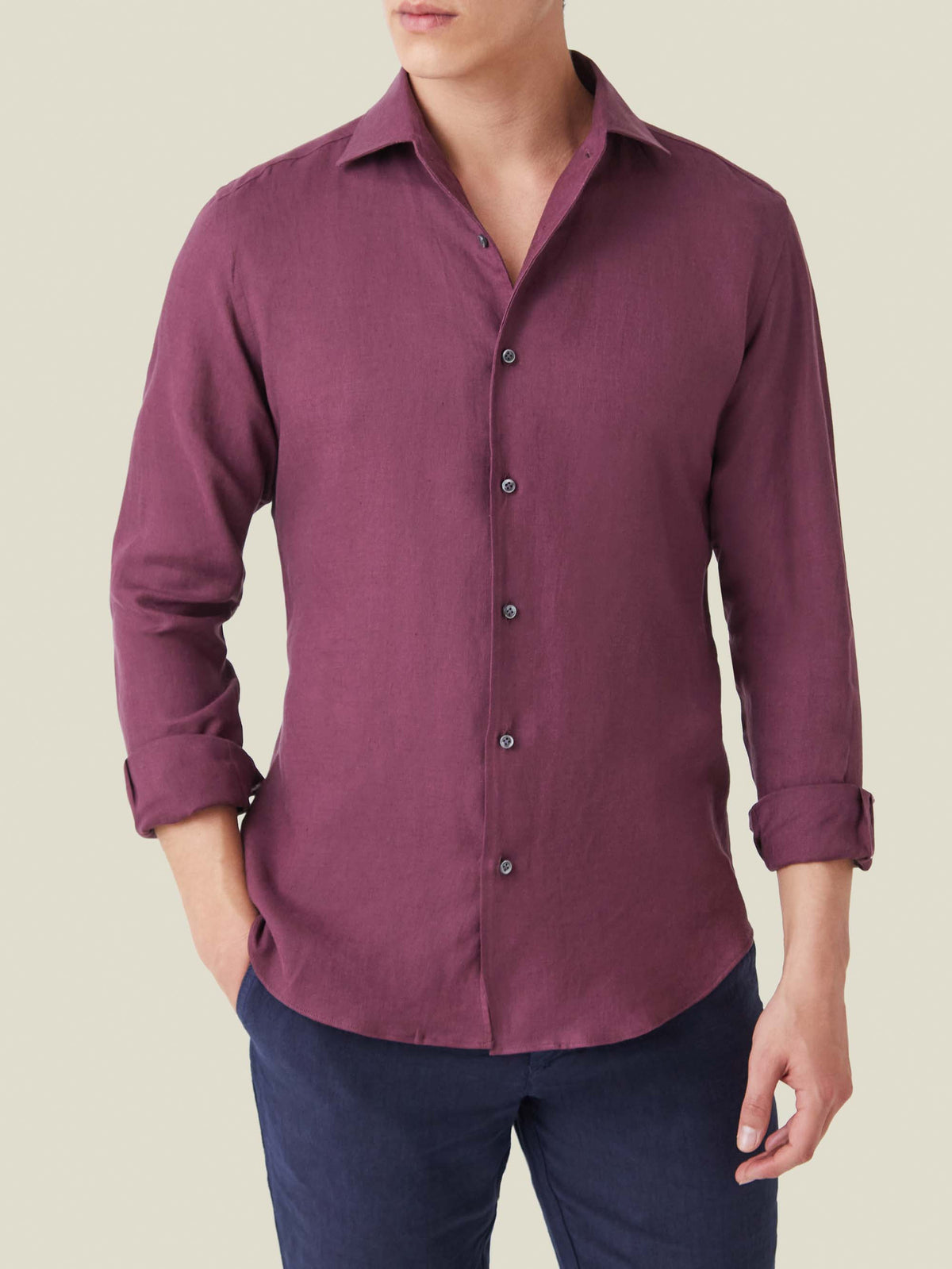 A model wears the Portofino Linen Shirt in burgundy, shown from the front with the sleeves casually rolled up.