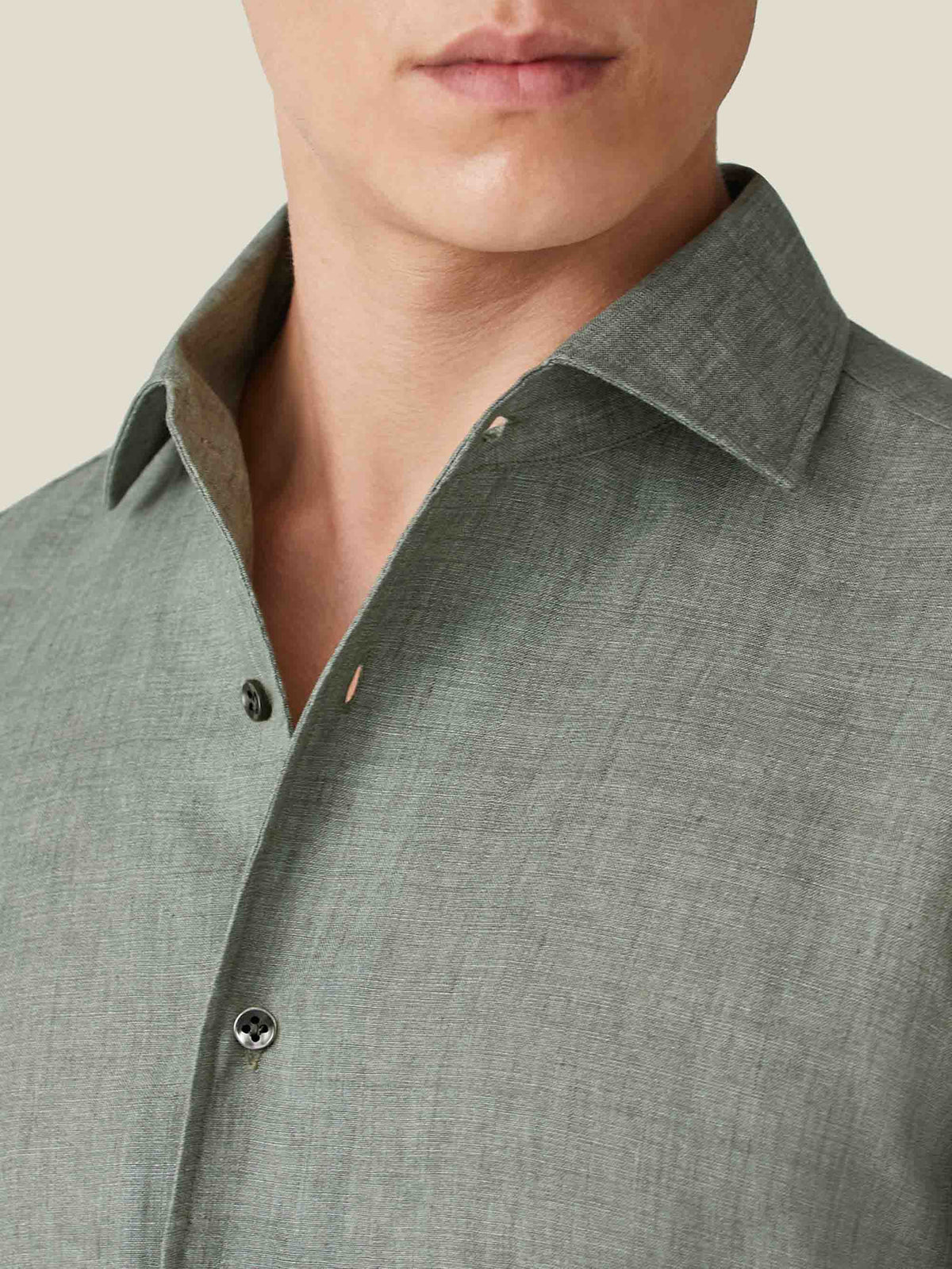 Detail shot of the one-piece collar on the safari green Portofino Linen Shirt, highlighting the Italian linen texture.