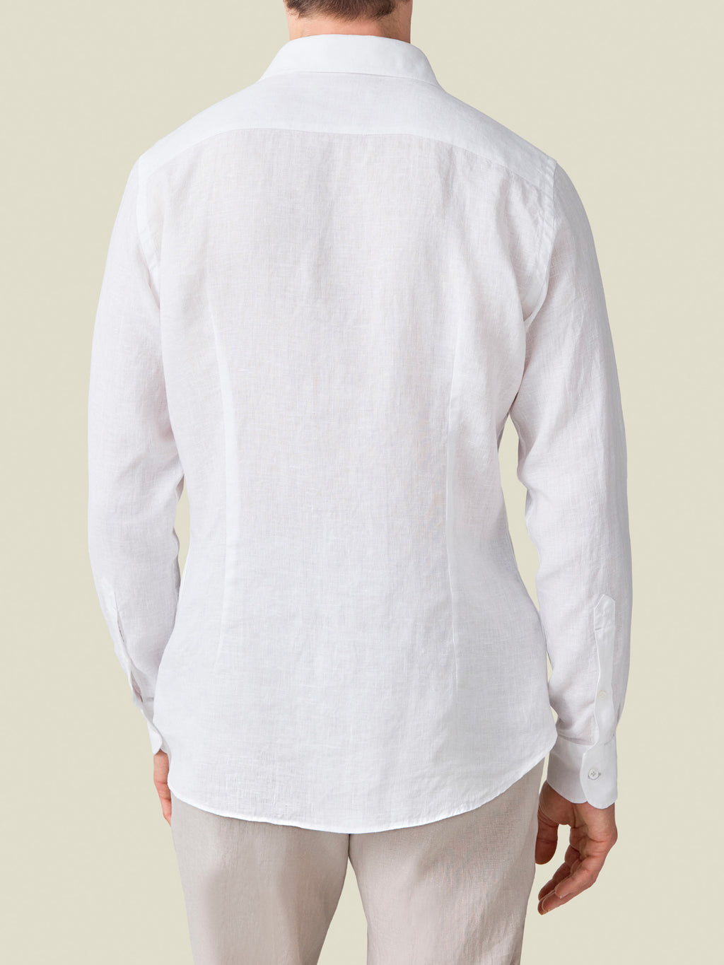 Back view of a model wearing the White Portofino Linen Shirt.