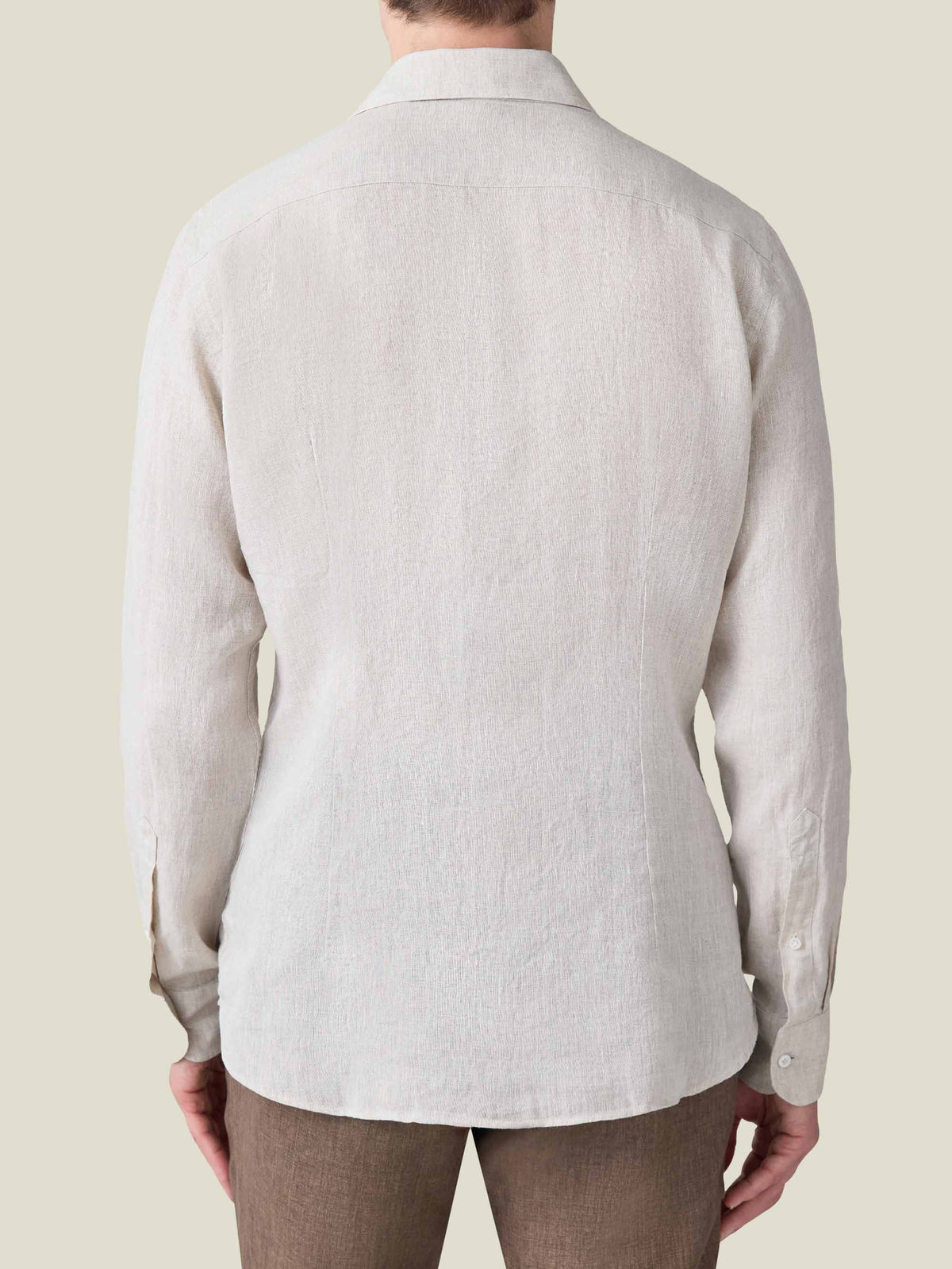 Back view of a model wearing the Portofino Linen Shirt in Sand.
