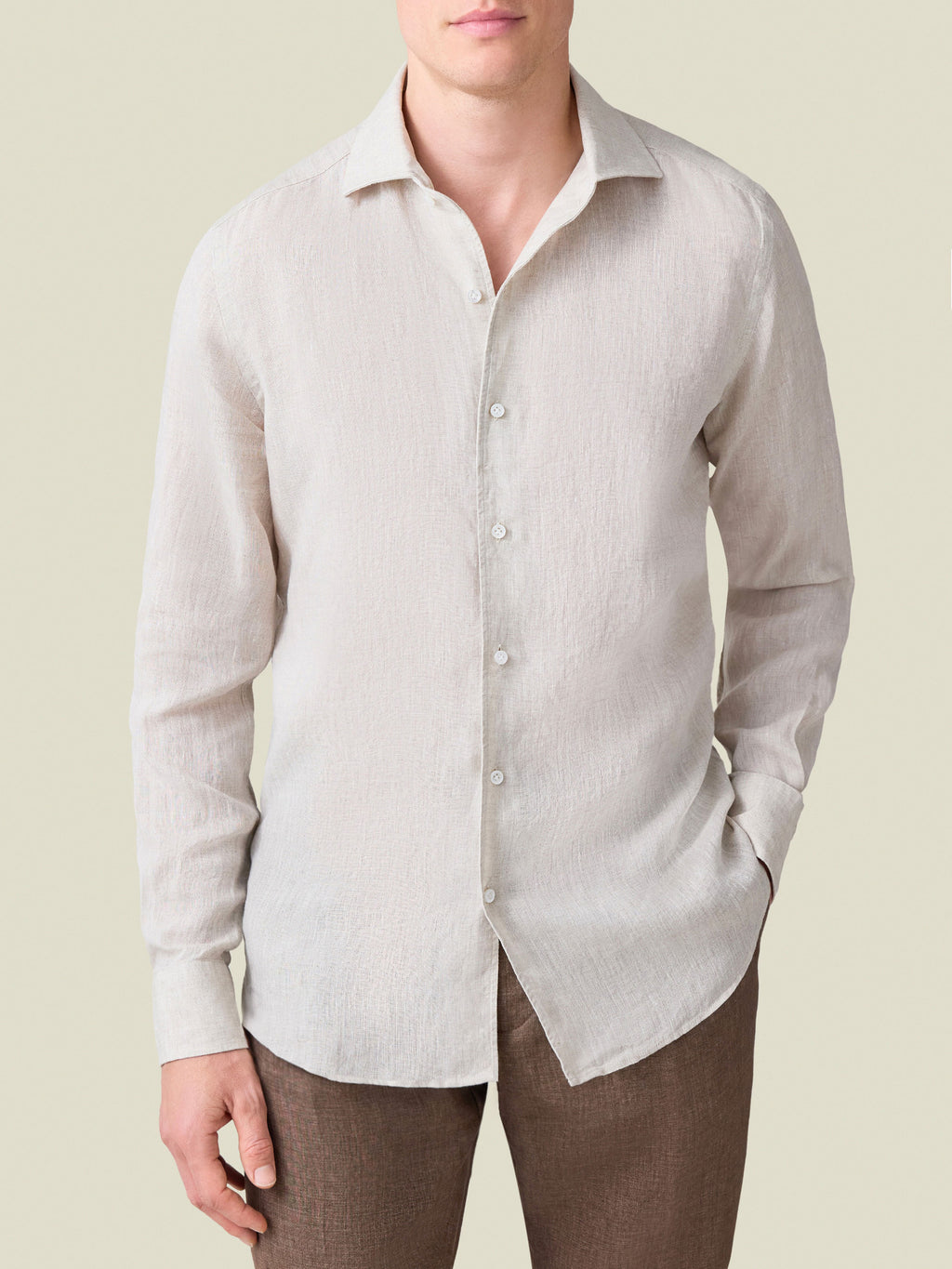 Front view of a model wearing the Luca Faloni Portofino Linen Shirt in sand.