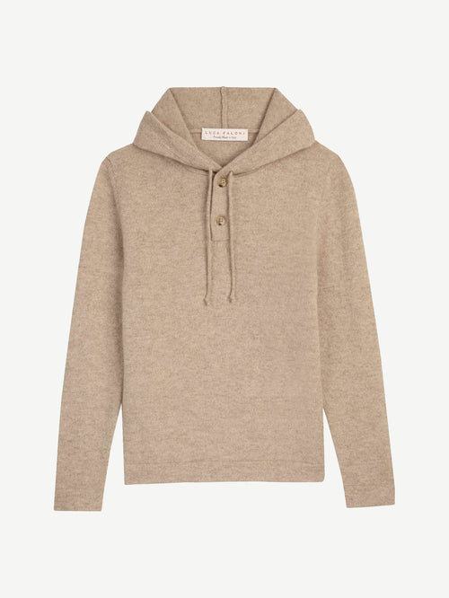 Flat lay of the Junior Cashmere Hoodie in beige, showing the front view with the hood and buttoned placket.