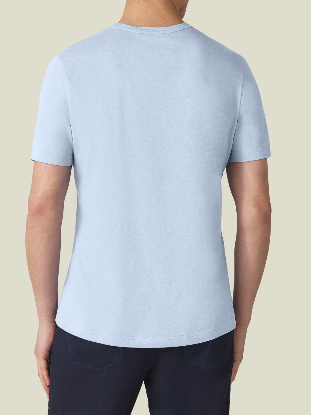 Back view of a man wearing the Light Blue Cashmere Cotton T-Shirt.
