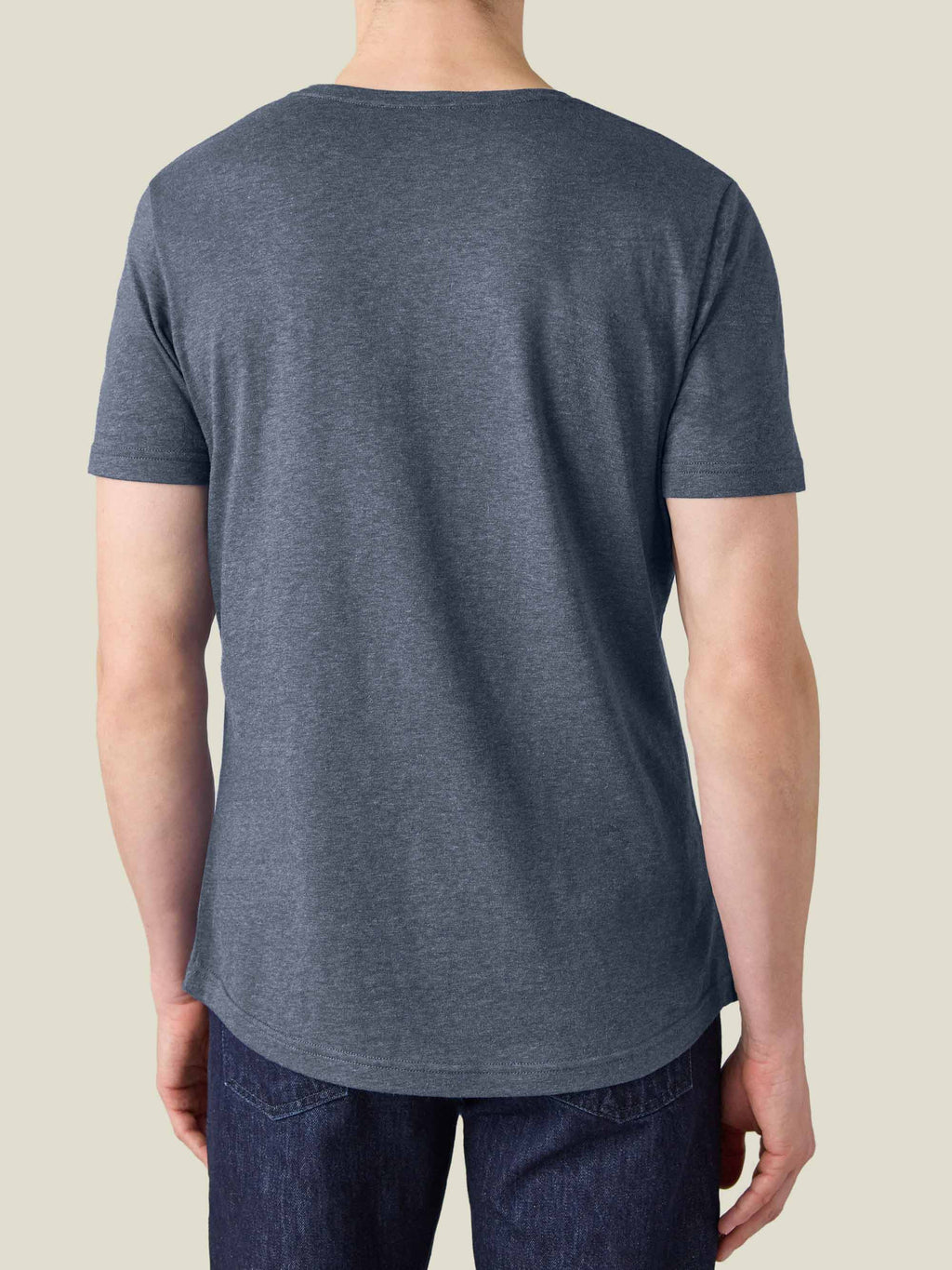 Back view of a model wearing the Atlantic Blue Cashmere cotton T-Shirt, showcasing its relaxed fit and curved hem.
