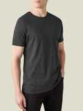 A model wears the Luca Faloni Cashmere Cotton T-Shirt in charcoal grey. Front-on view showing the relaxed fit and crew neck.