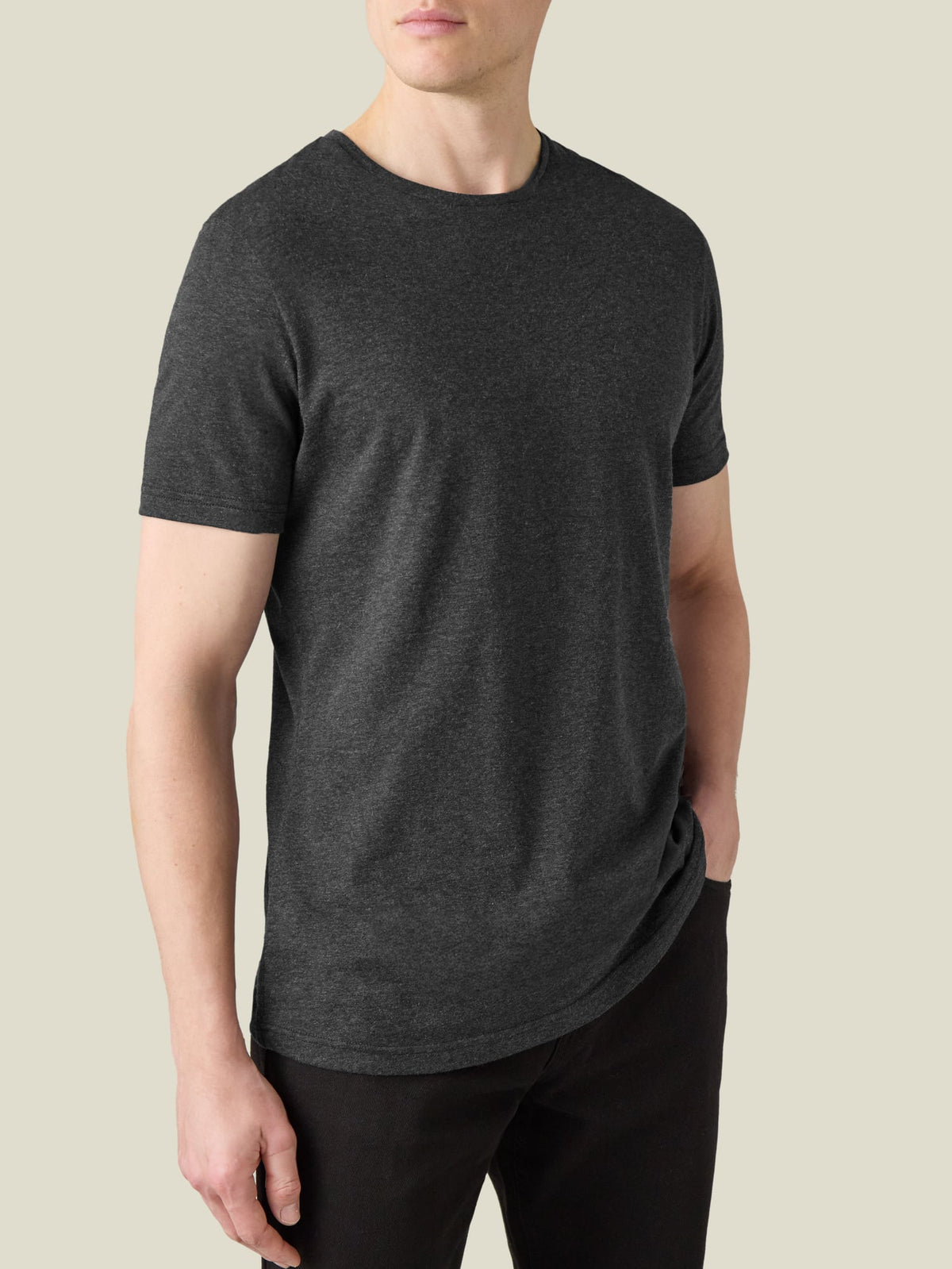 A model wears the Luca Faloni Cashmere Cotton T-Shirt in charcoal grey. Front-on view showing the relaxed fit and crew neck.