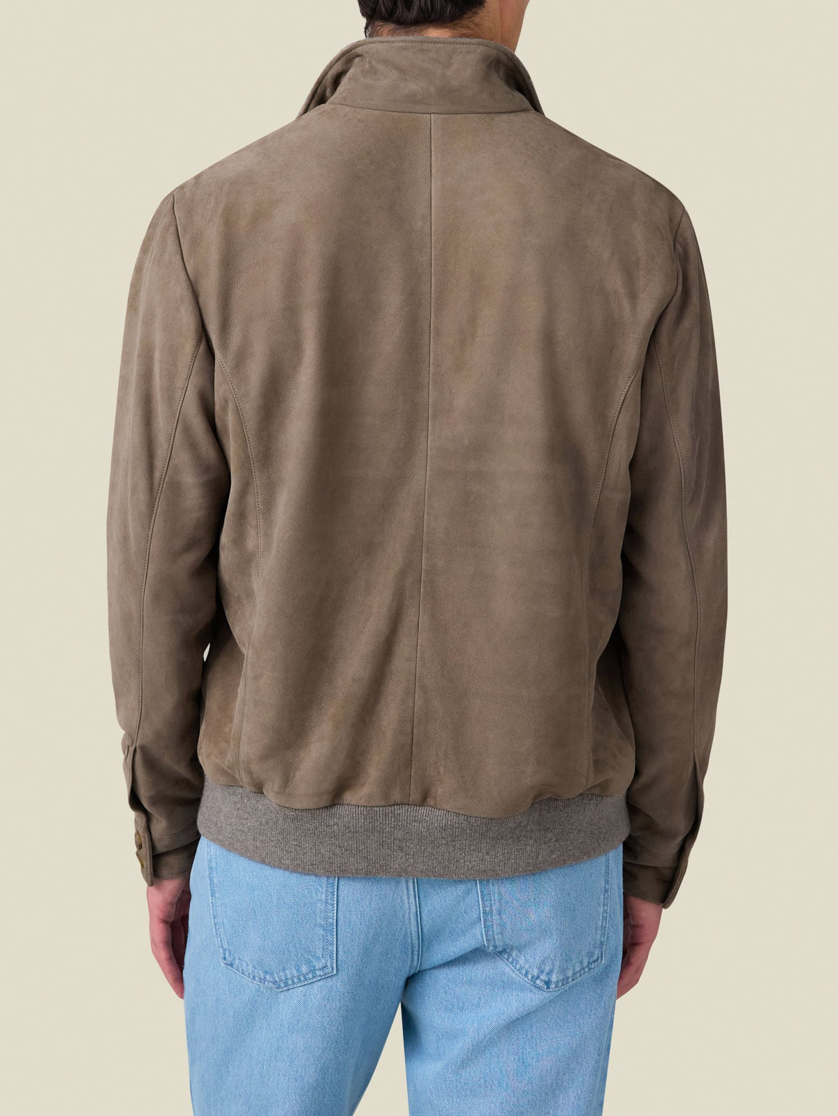 Back view of a model wearing the Classic Bomber Jacket in hazelnut brown suede leather.
