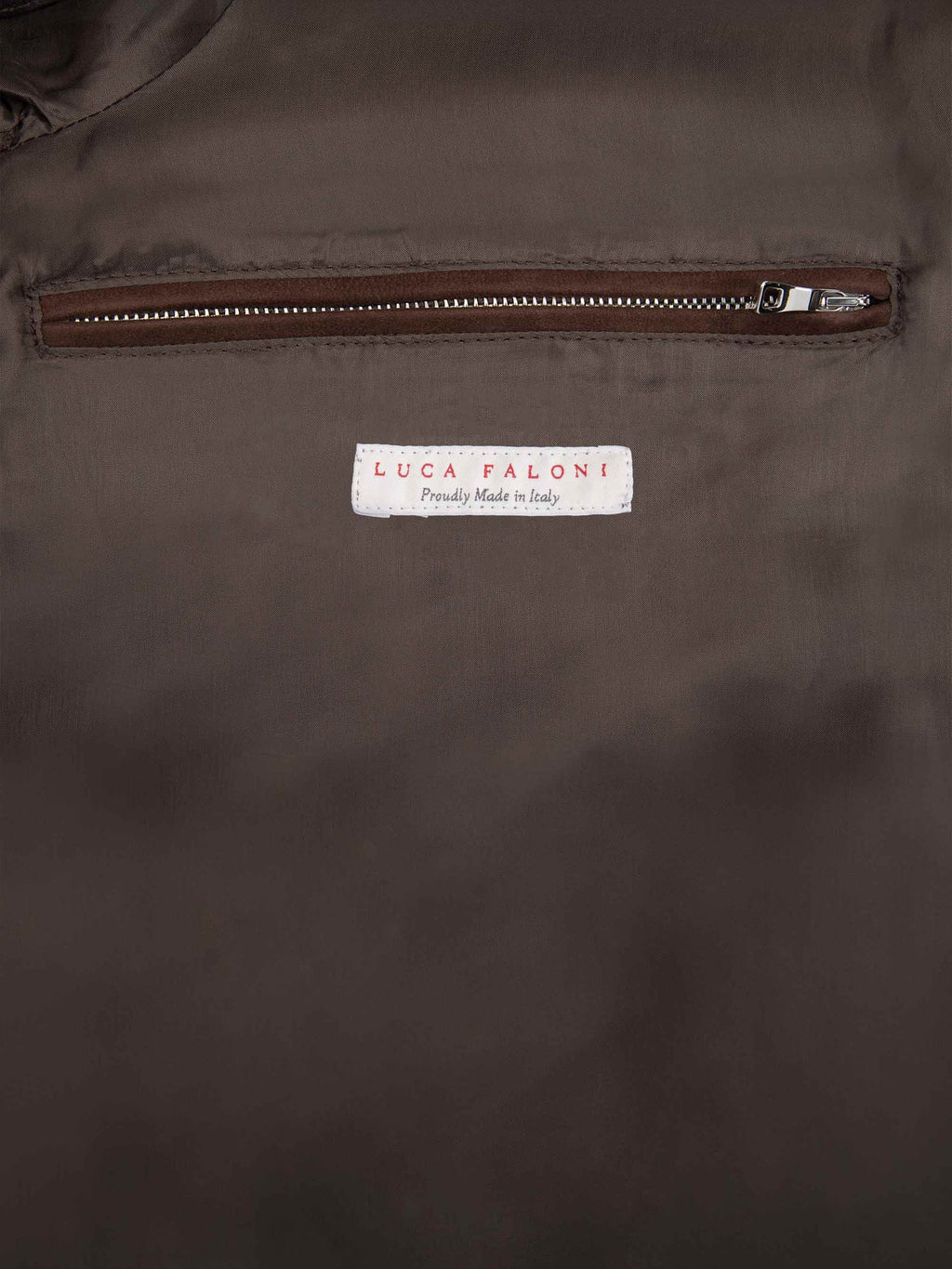 Close-up of the internal zipped pocket and 'Made in Italy' label on the Chocolate Brown Classic Bomber Jacket.