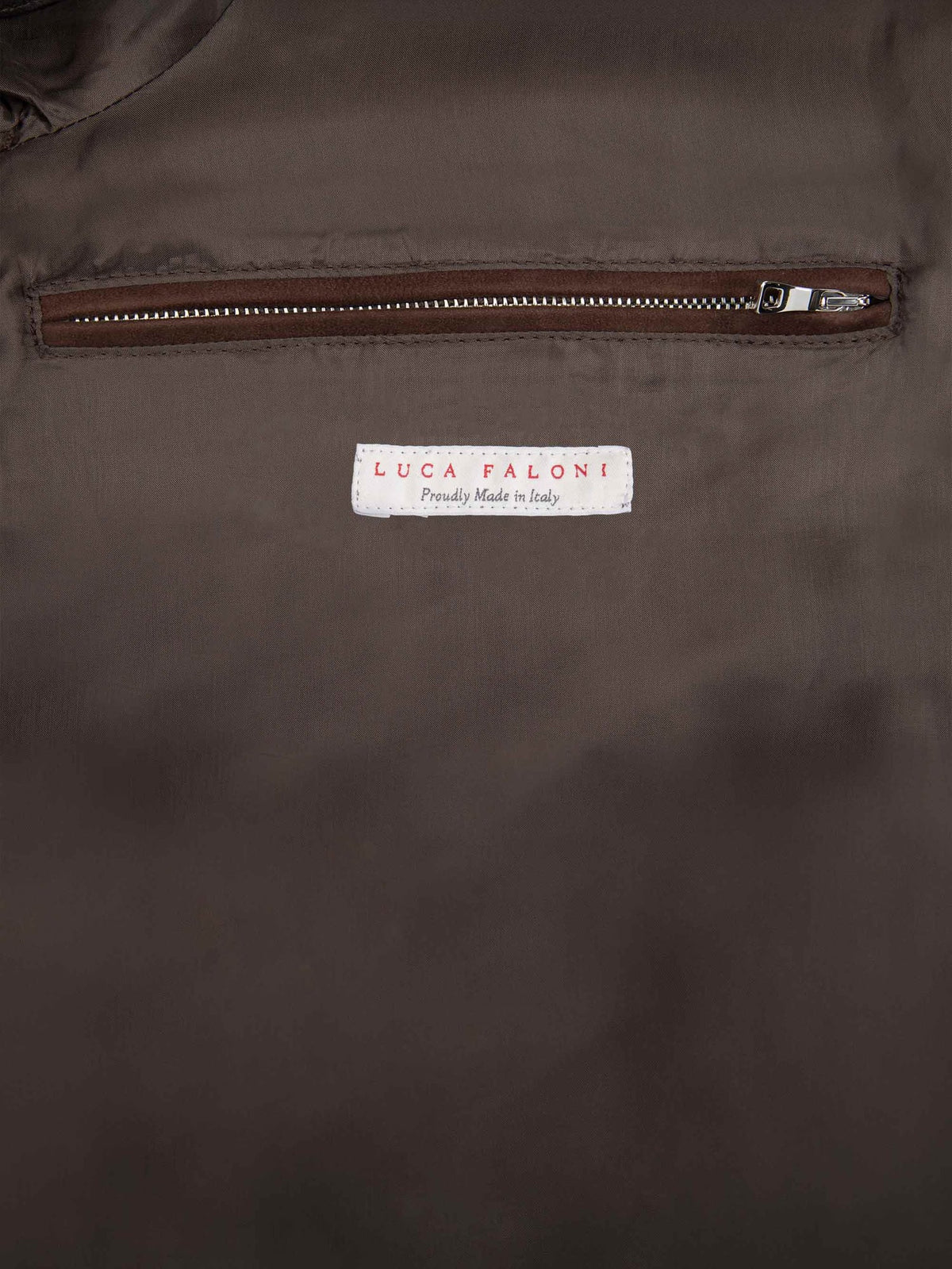 Close-up of the internal zipped pocket and 'Made in Italy' label on the Chocolate Brown Classic Bomber Jacket.