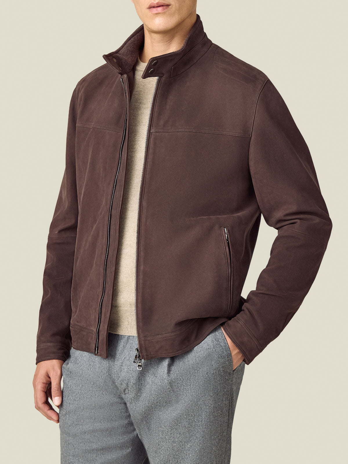 Model wearing the Luca Faloni Classic Racer Jacket in chocolate brown goatskin suede, shown from the waist up.