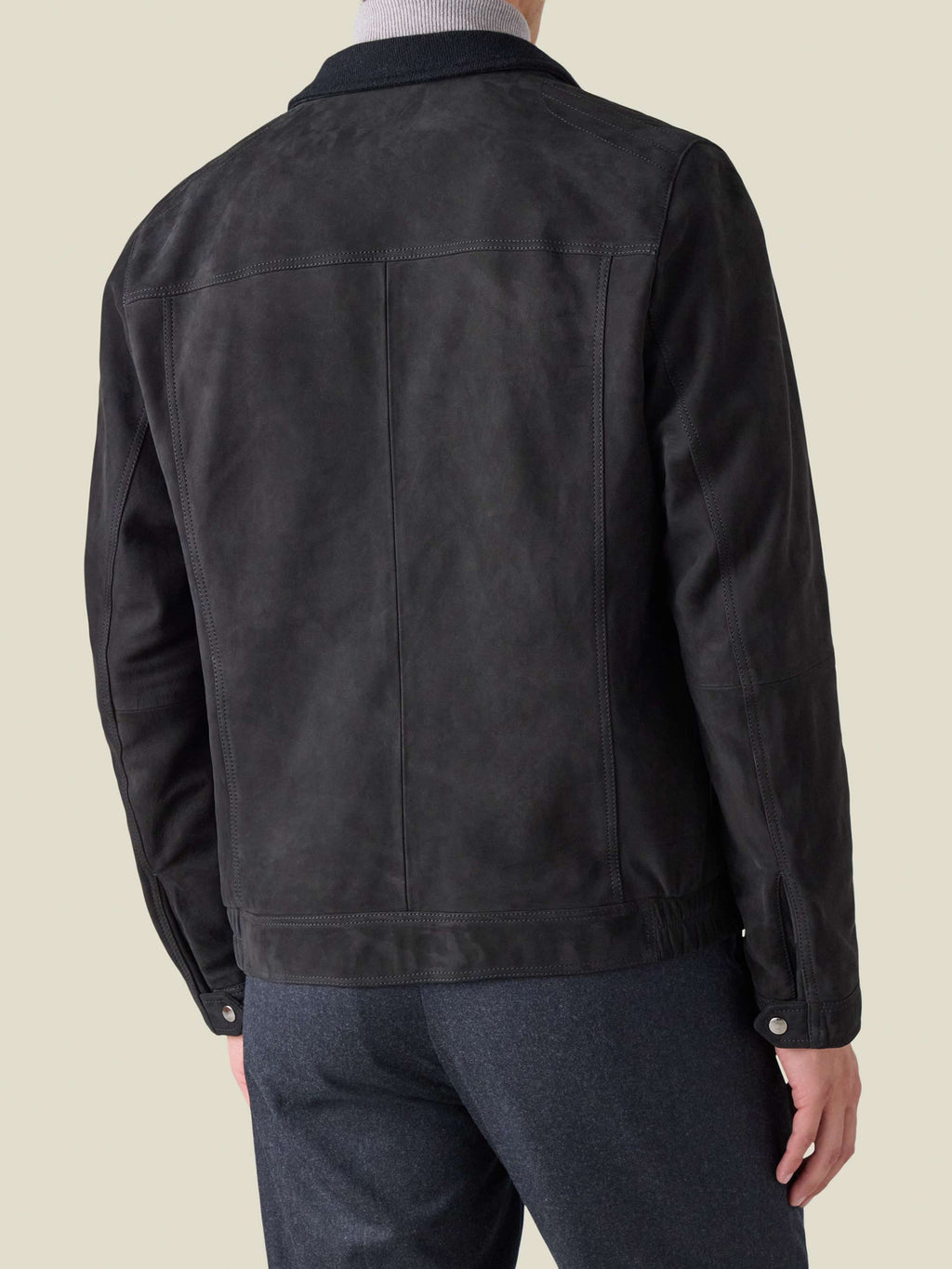 Rear view of a man wearing the Classic Racer Jacket in black goatskin suede, showing the yoke and fit.