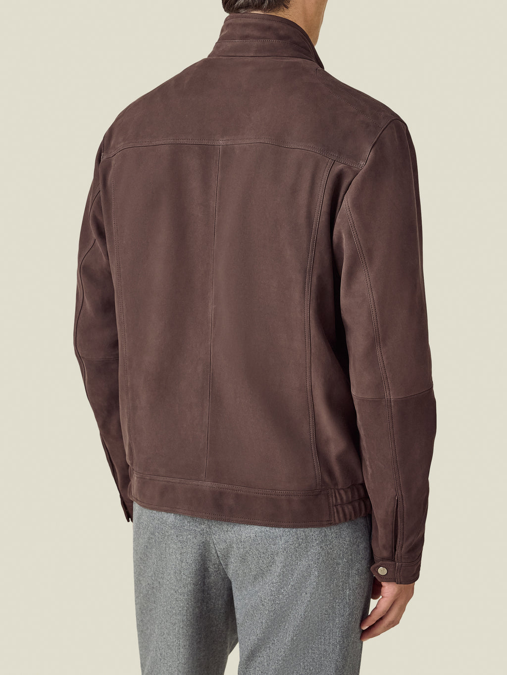 Back view of a model wearing the Luca Faloni Classic Racer Jacket in chocolate brown.