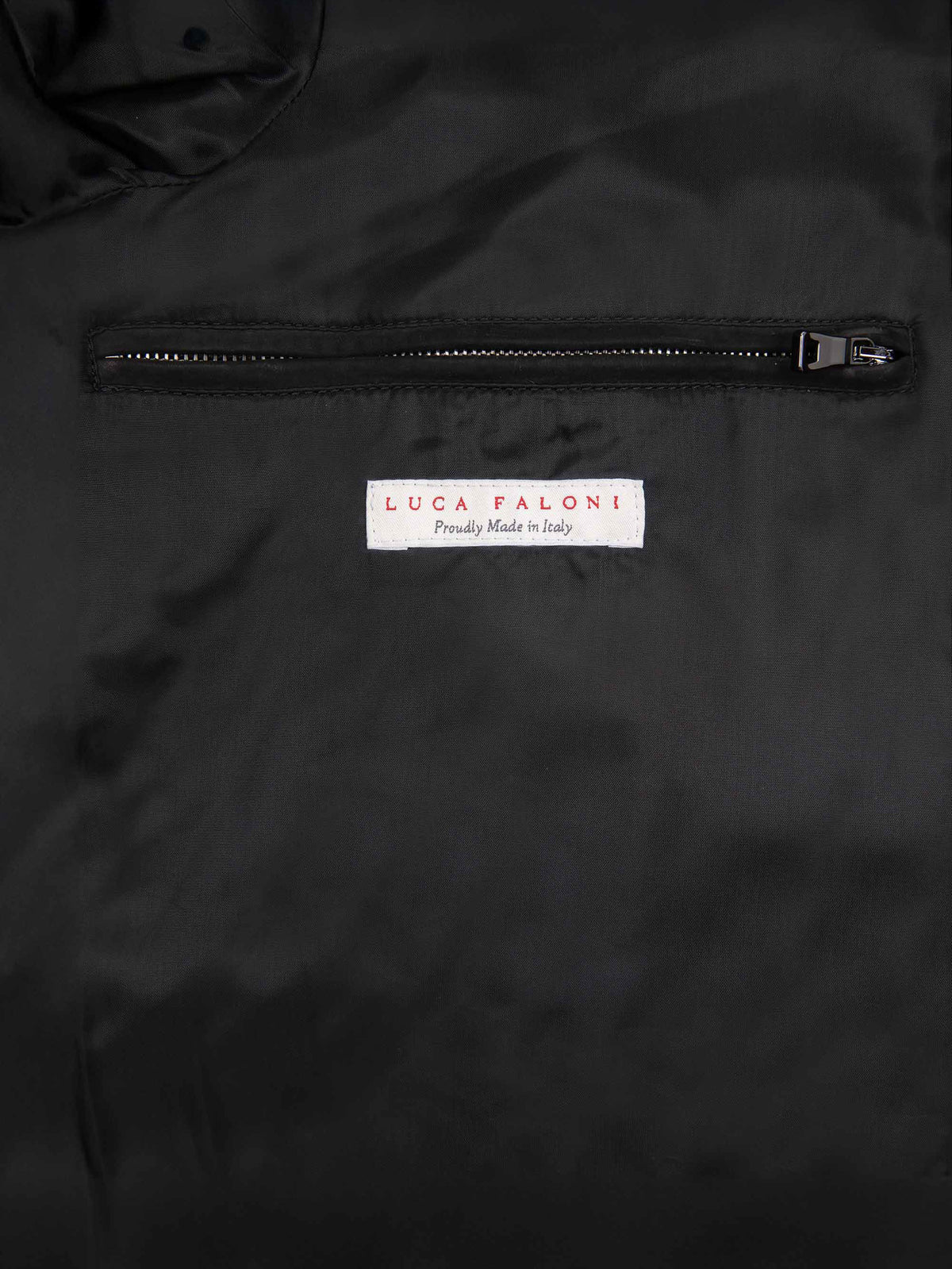 Detail of the Classic Racer Jacket's lining, with the internal zipped pocket and Luca Faloni 'Made in Italy' label.