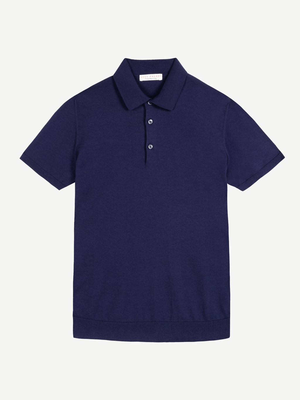 Front view of the navy Knitted Cotton Polo laid flat against a white background.