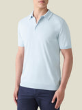 Model wearing the Luca Faloni Knitted Cotton Polo in Light Blue.