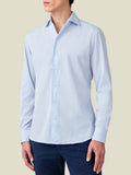 Front view of a model wearing the Luca Faloni Light Blue Lightweight Poplin Cotton Shirt, styled with navy trousers.