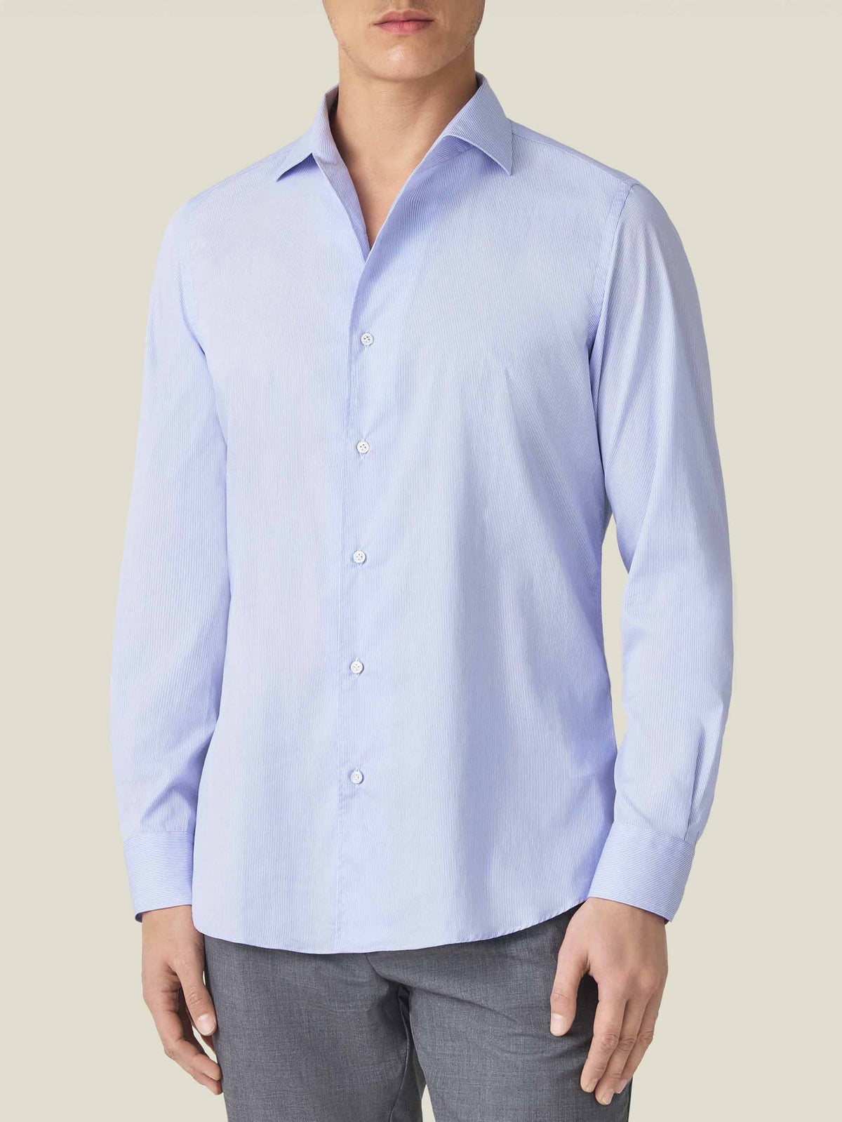 Front view of a model wearing the Striped Light Blue Lightweight Poplin Cotton Shirt.