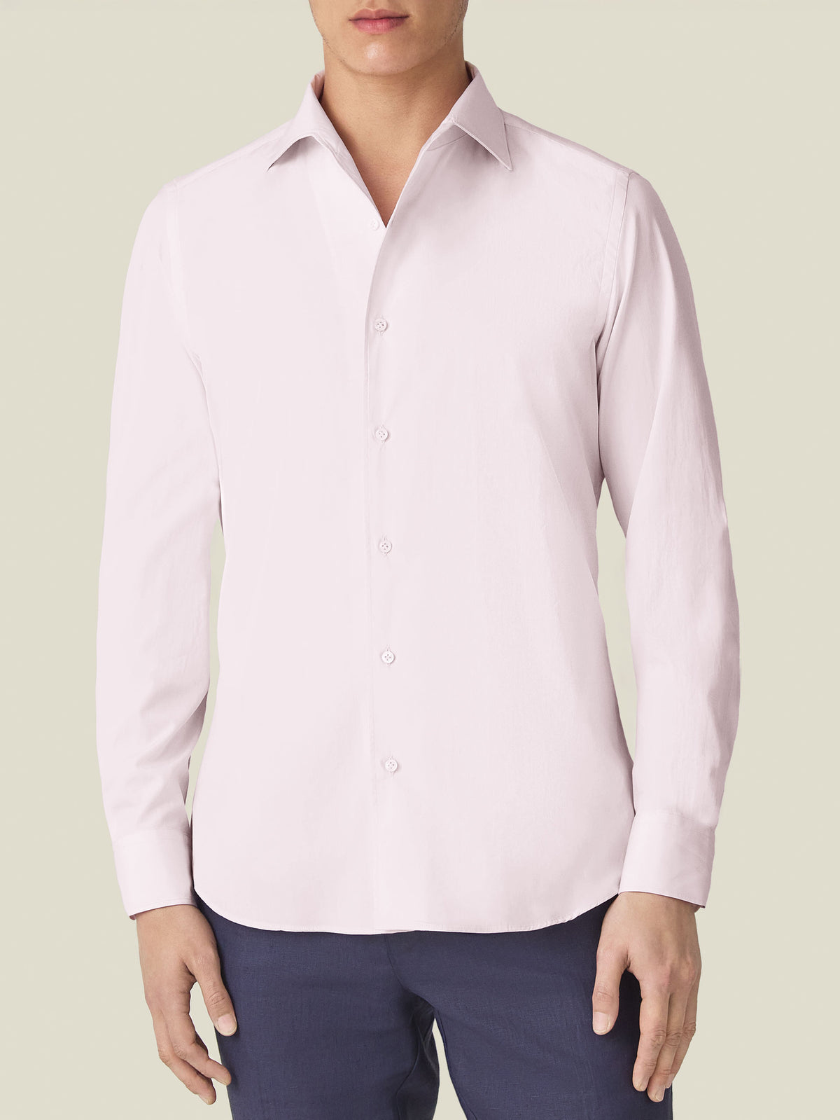 Front view of a model wearing the Luca Faloni Lightweight Poplin Cotton Shirt in light pink.