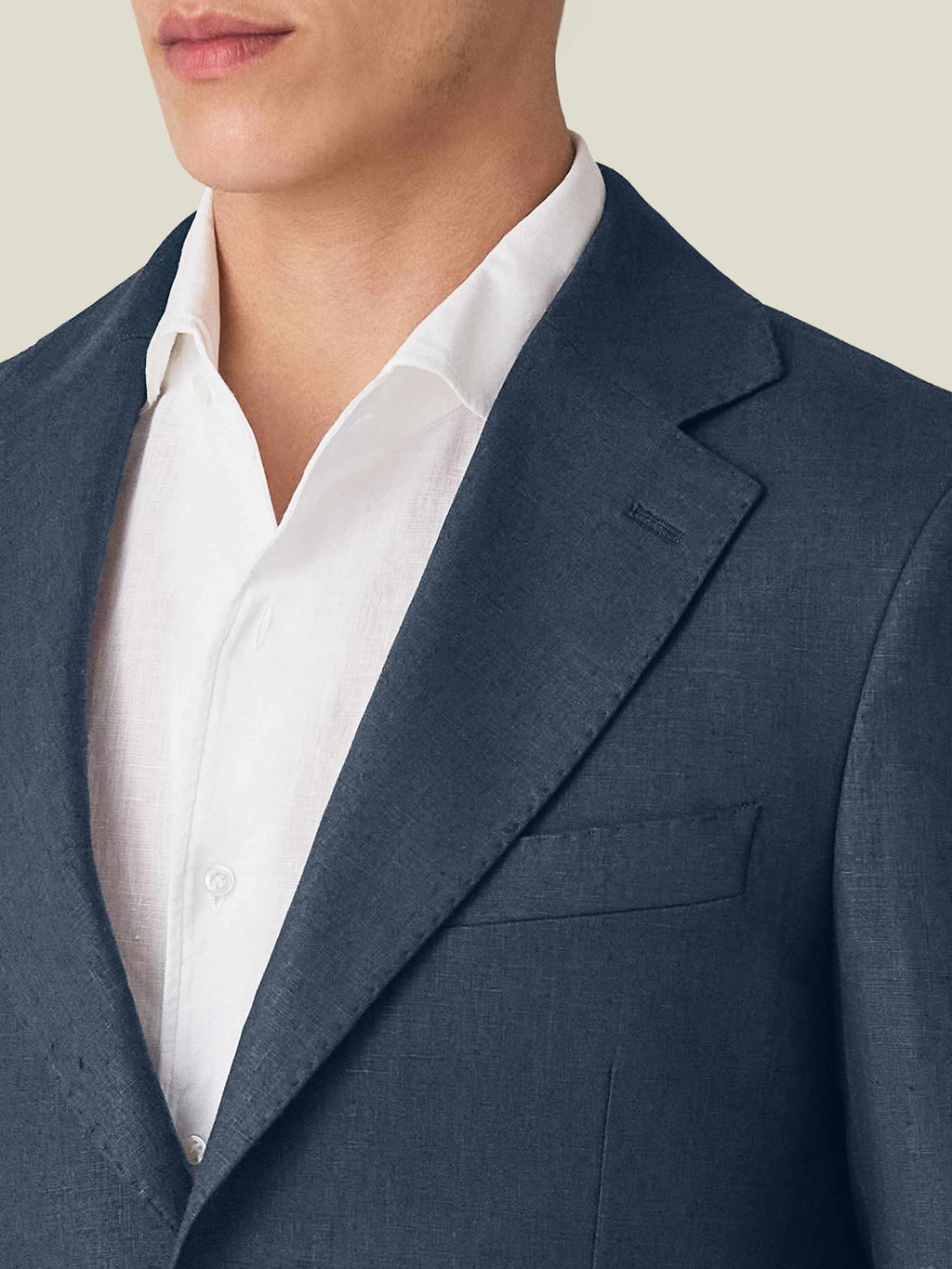 Close-up of the Navy Blue Linen Suit blazer, highlighting the notch lapel, chest pocket, and textured linen fabric.