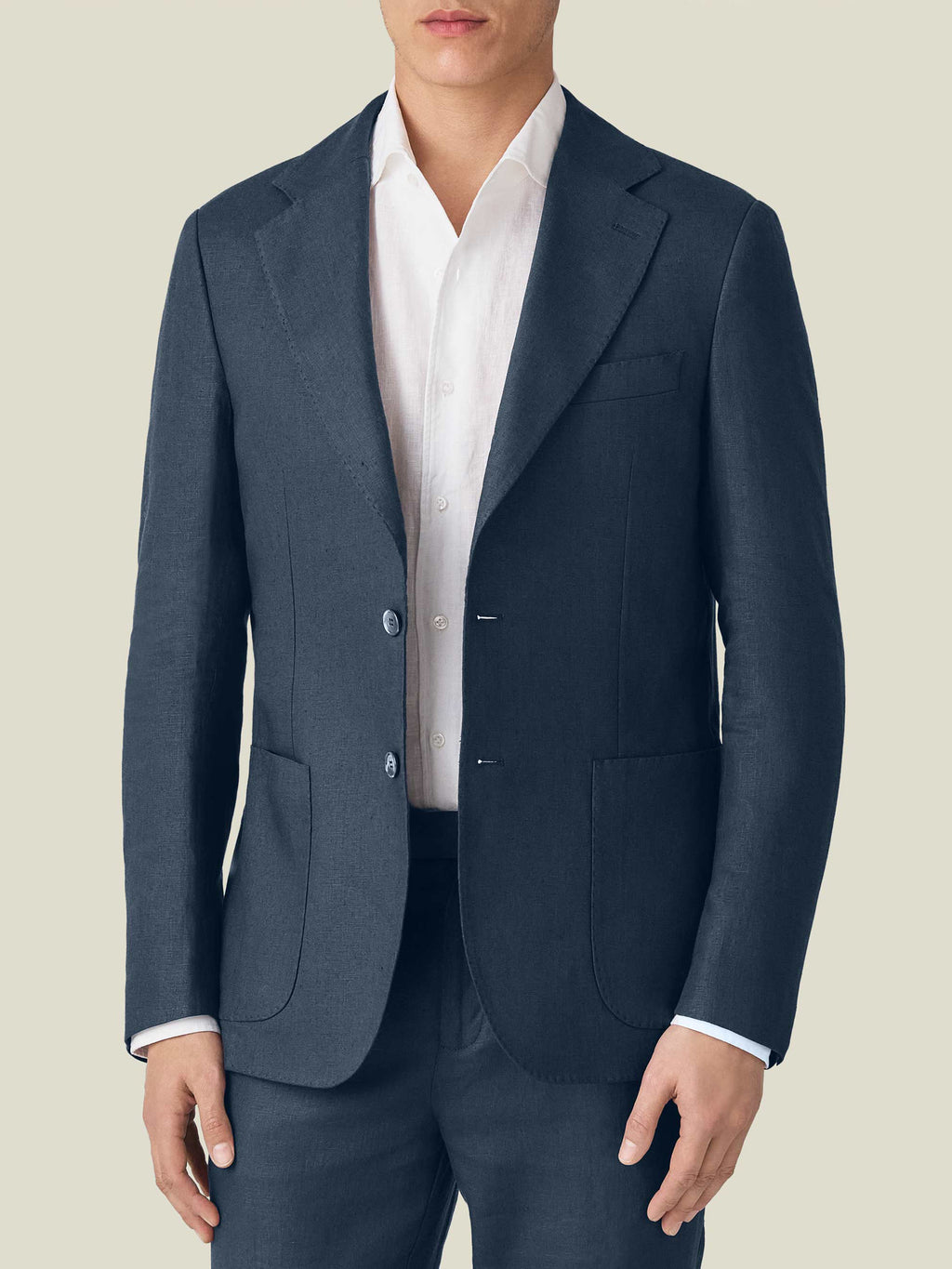 Front view of a model wearing the Luca Faloni Navy Blue Linen Suit blazer over a white shirt, showcasing its tailored fit.
