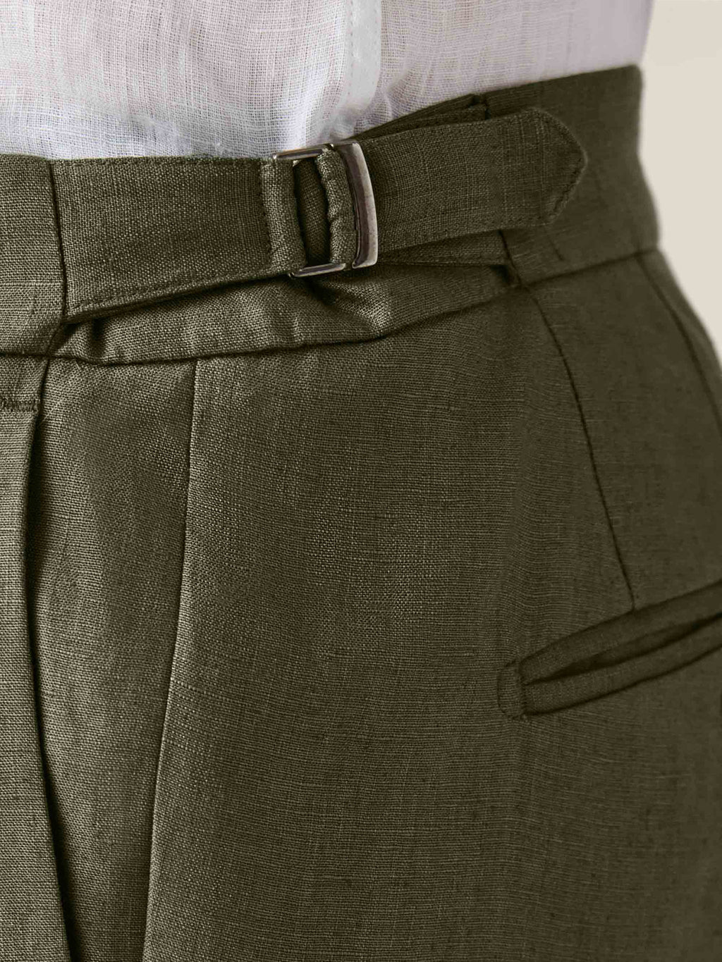 Close-up of the side adjuster buckle on the Luca Faloni Olive Green Linen Suit trousers, highlighting the linen fabric.