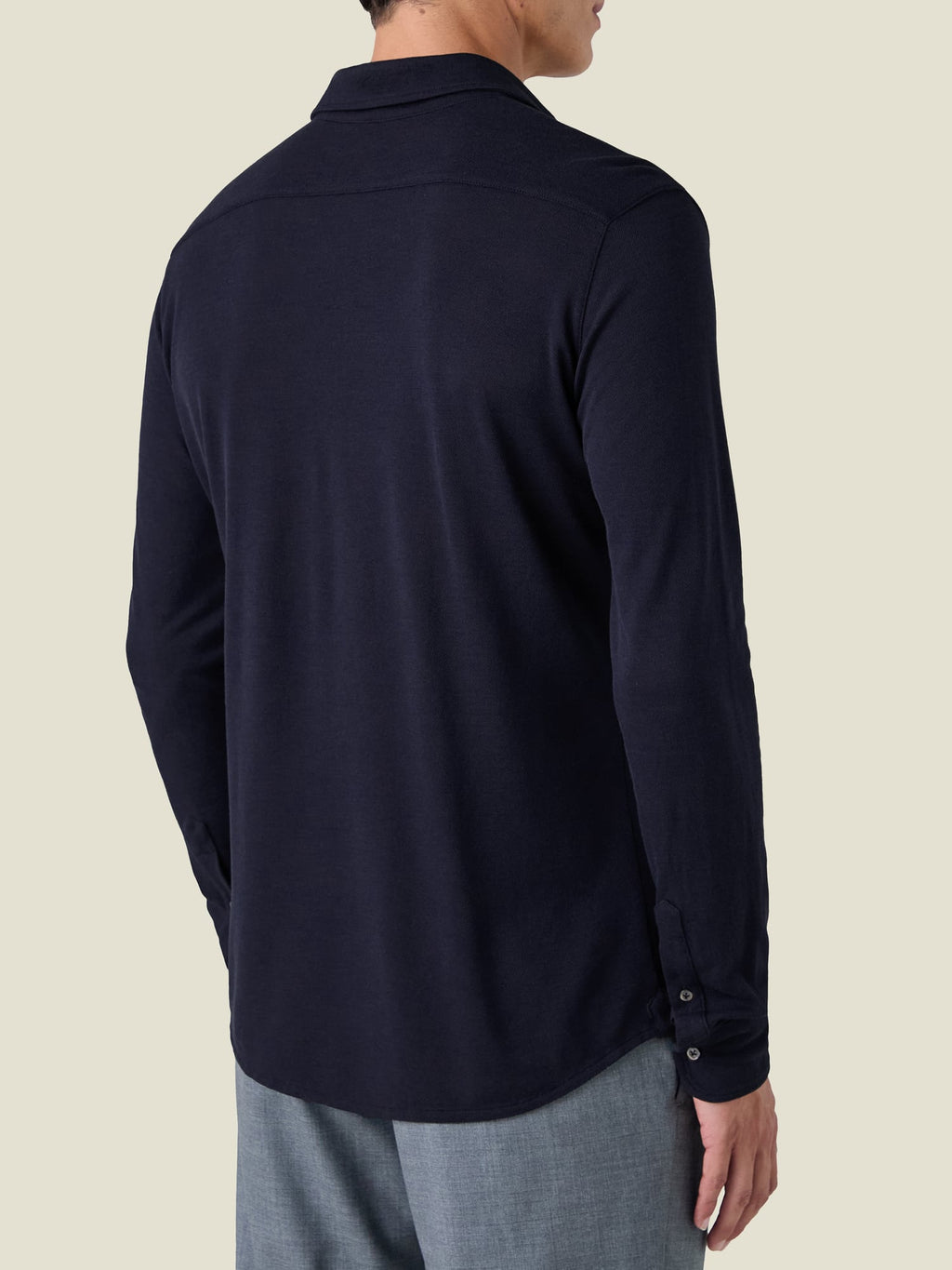 Back view of a man wearing the Silk-Cotton Piqué Shirt in Midnight Blue.