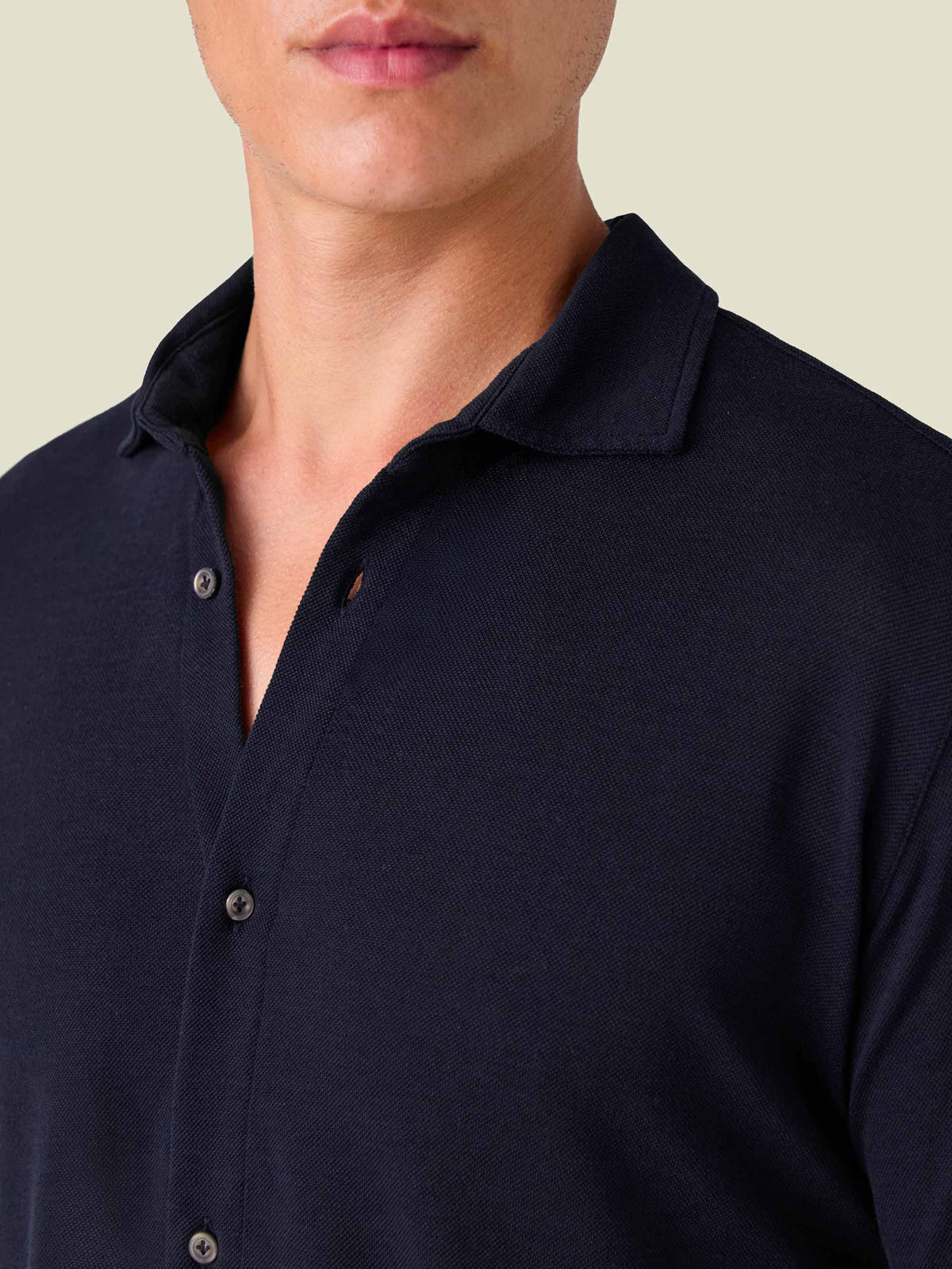 A close-up of the Luca Faloni Silk-Cotton Piqué Shirt in Midnight Blue, highlighting the cutaway collar and fabric texture.