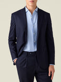 A front view of a model wearing the Luca Faloni Midnight Blue Wool Blazer with matching wool trousers and a light blue shirt.