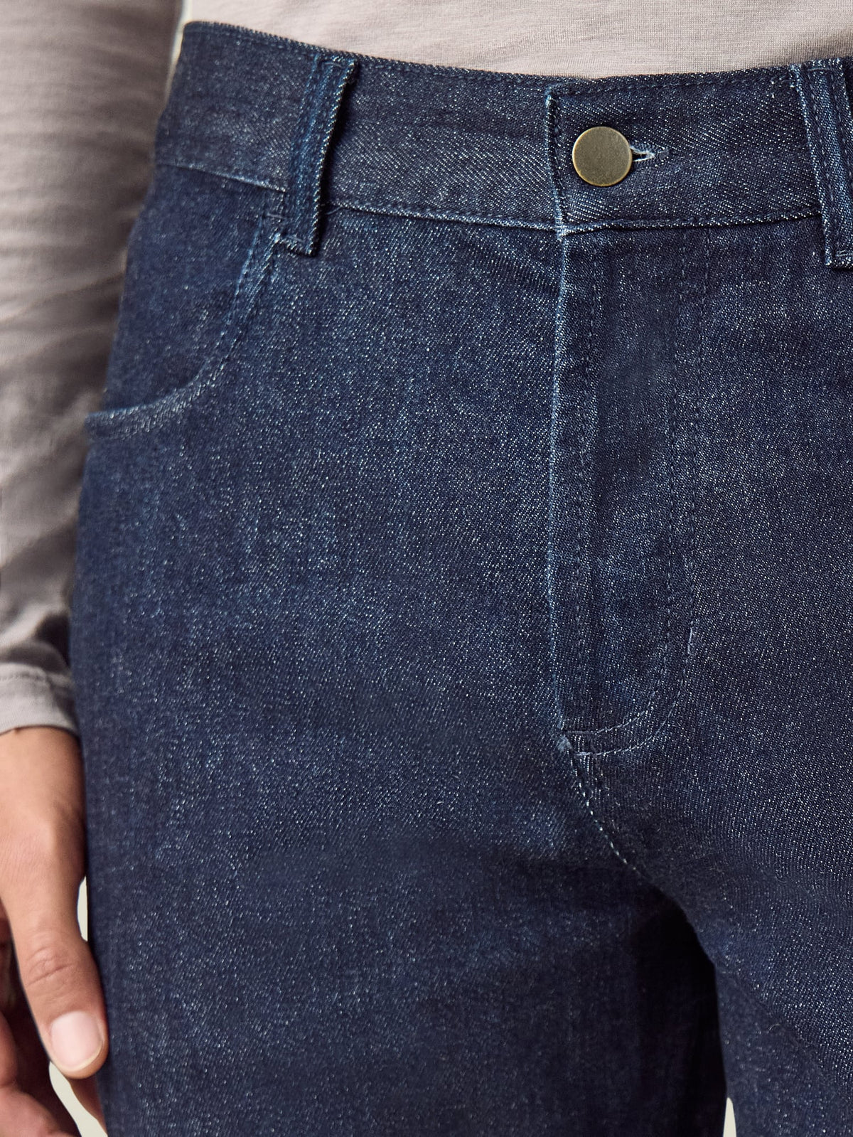 Close-up of the Luca Faloni Cashmere Denim Jeans in dark blue, showing the front pocket and button fly detail.
