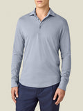 A front view of a model wearing the Luca Faloni Cashmere-Cotton Long Sleeved Polo shirt in French Blue.