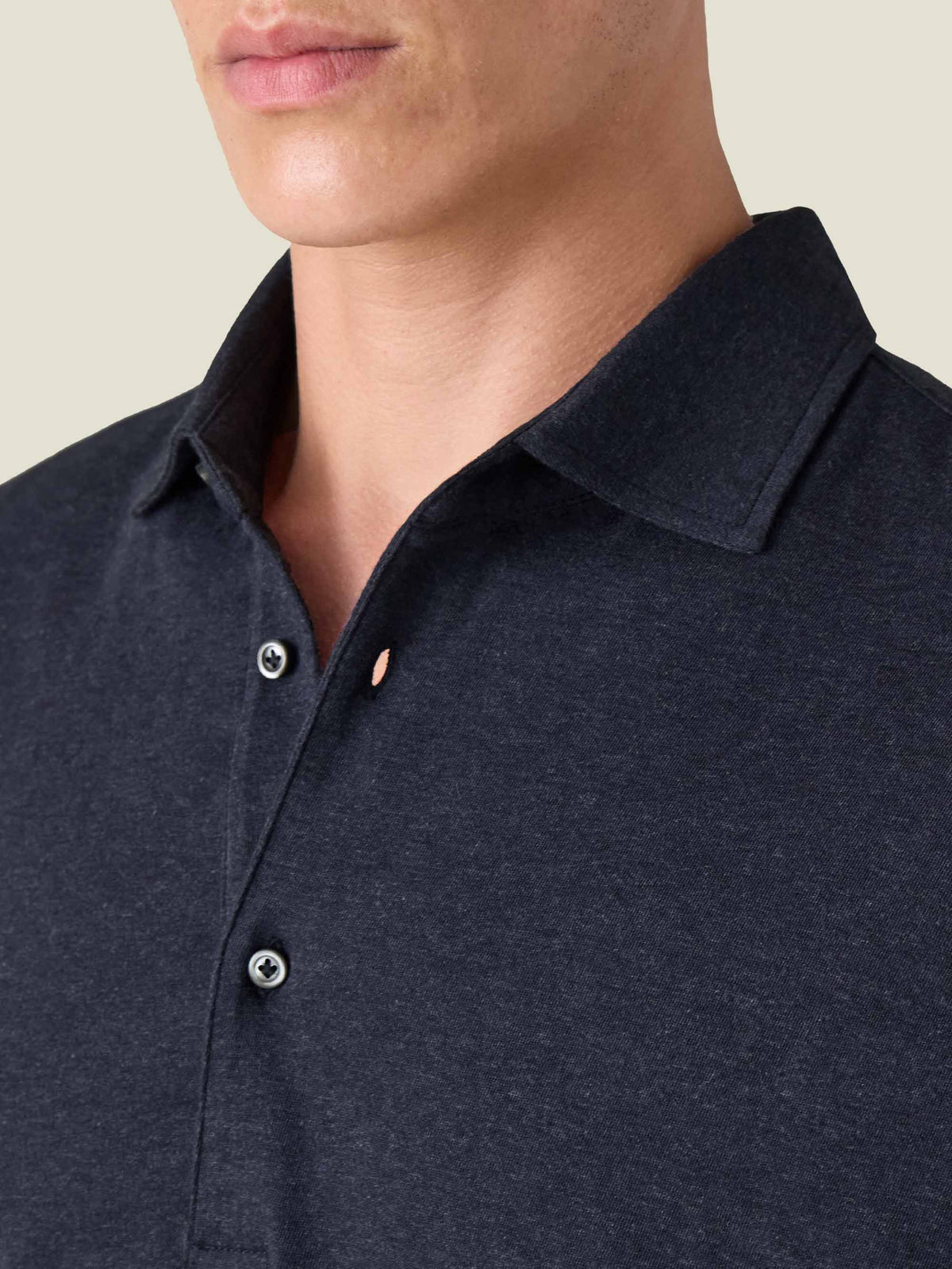 A close-up of the classic collar and mother-of-pearl buttons on the Midnight Blue Cashmere-Cotton Long Sleeved Polo Shirt.