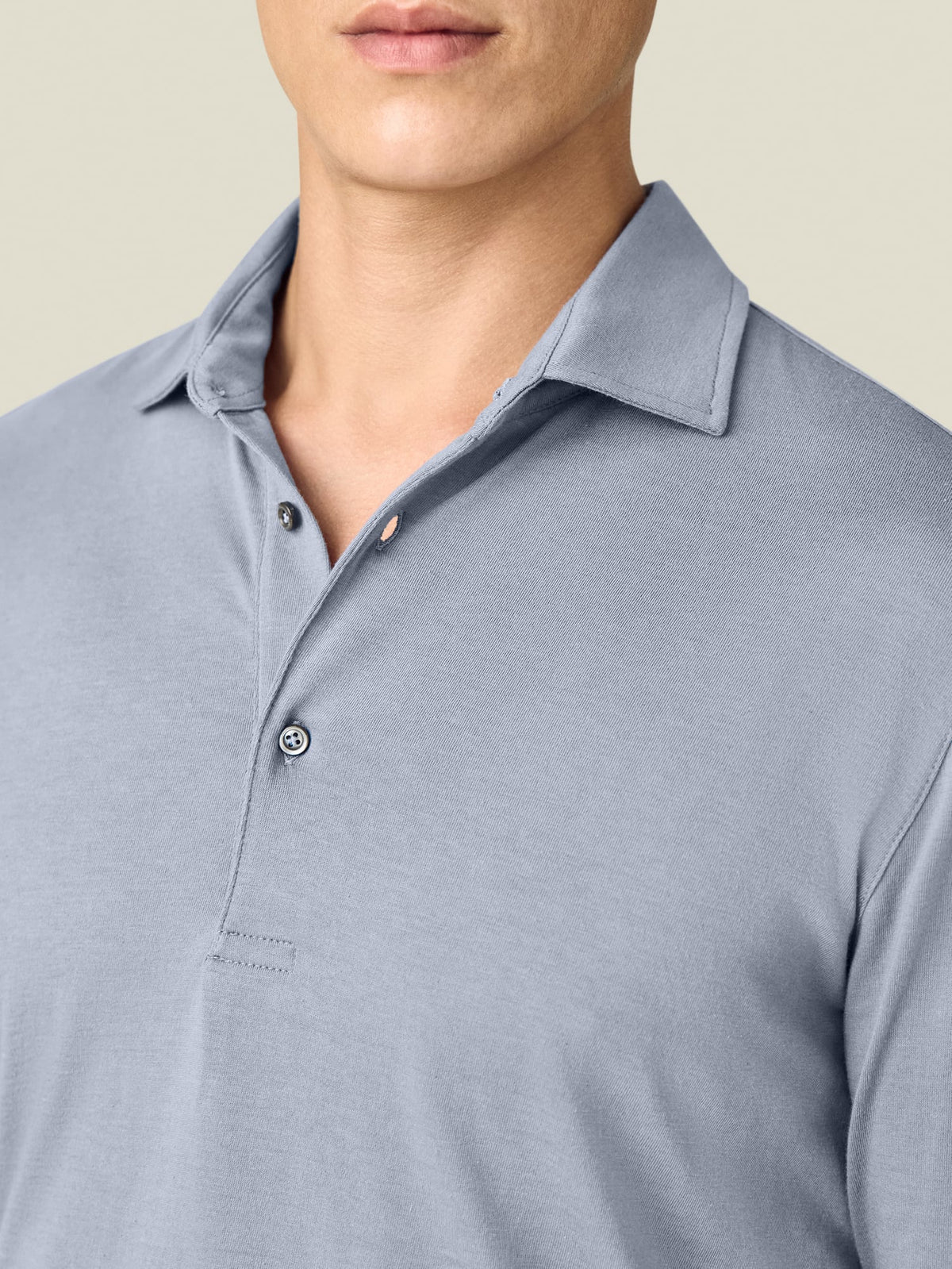 A close-up of the Luca Faloni Cashmere-Cotton Polo shirt in French Blue, detailing the classic collar and buttons.