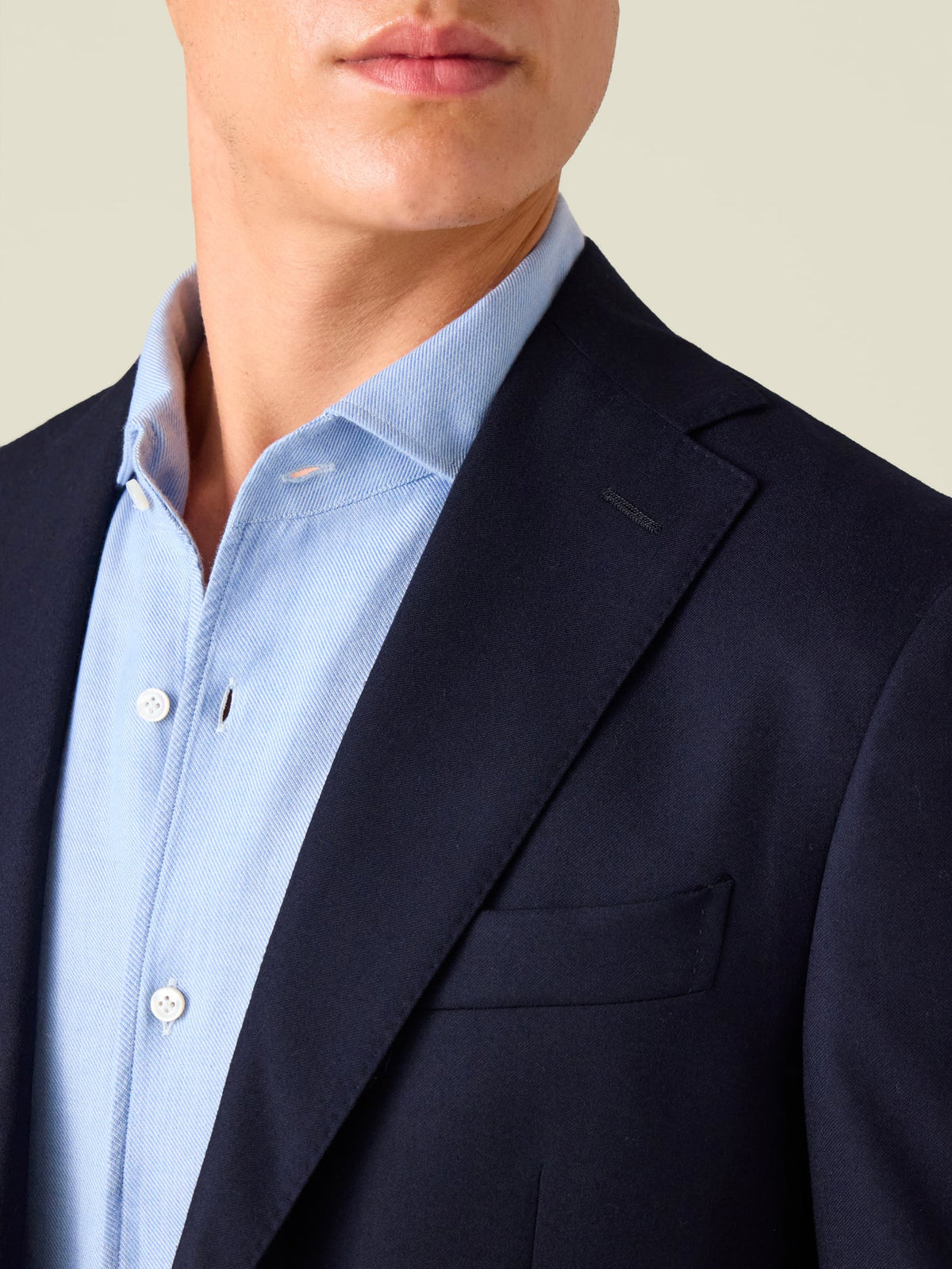 A close-up of the Midnight Blue Wool Suit jacket, detailing the notch lapel, chest pocket, and fine wool texture.