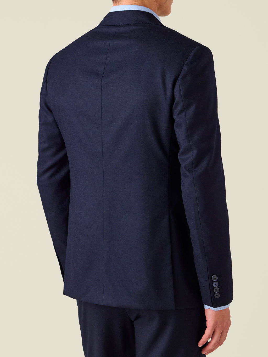 Back view of the Midnight Blue Wool Suit, showcasing the tailored silhouette and structured shoulders of the jacket.