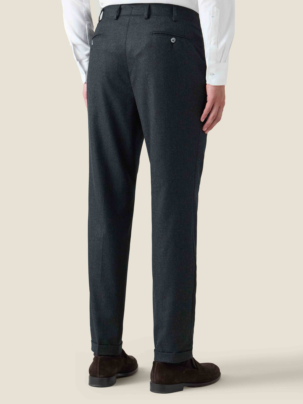 Back view of the Charcoal Grey Wool Suit trousers, showcasing the slim fit, back pocket, and cuffed hem.