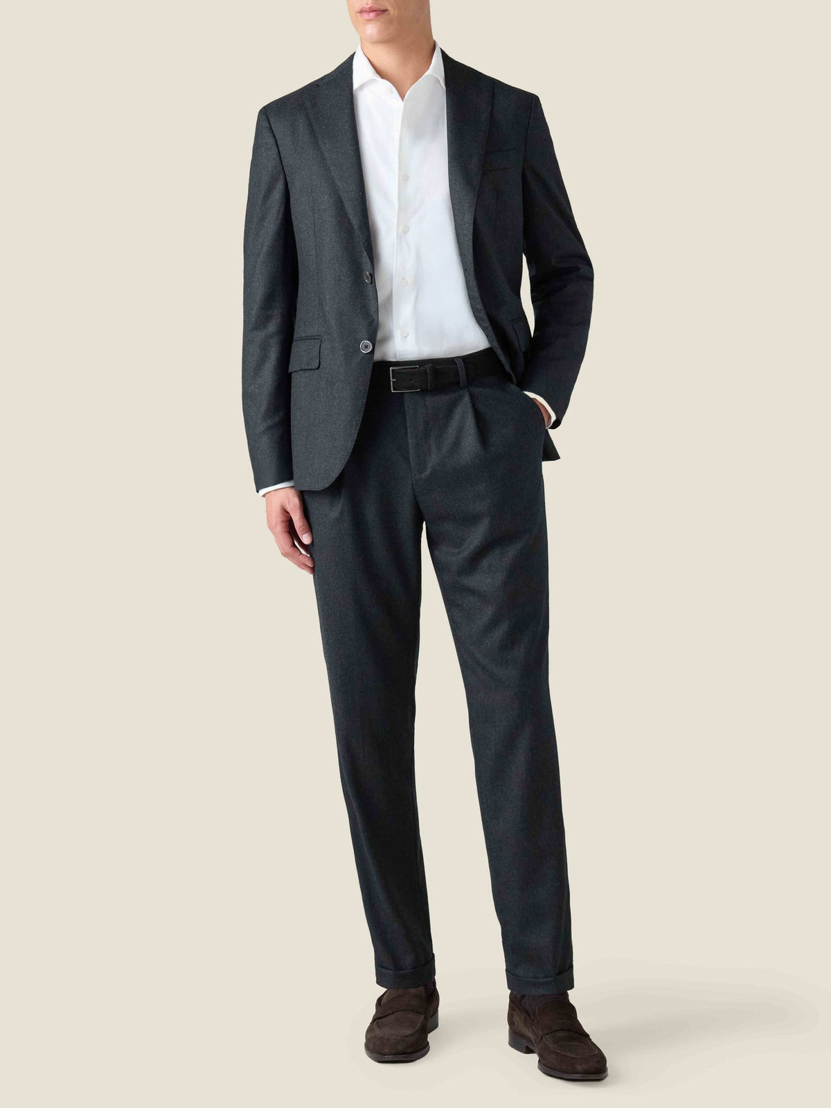 Full-length view of a model wearing the Charcoal Grey Wool Suit, styled with a white shirt and dark brown loafers.