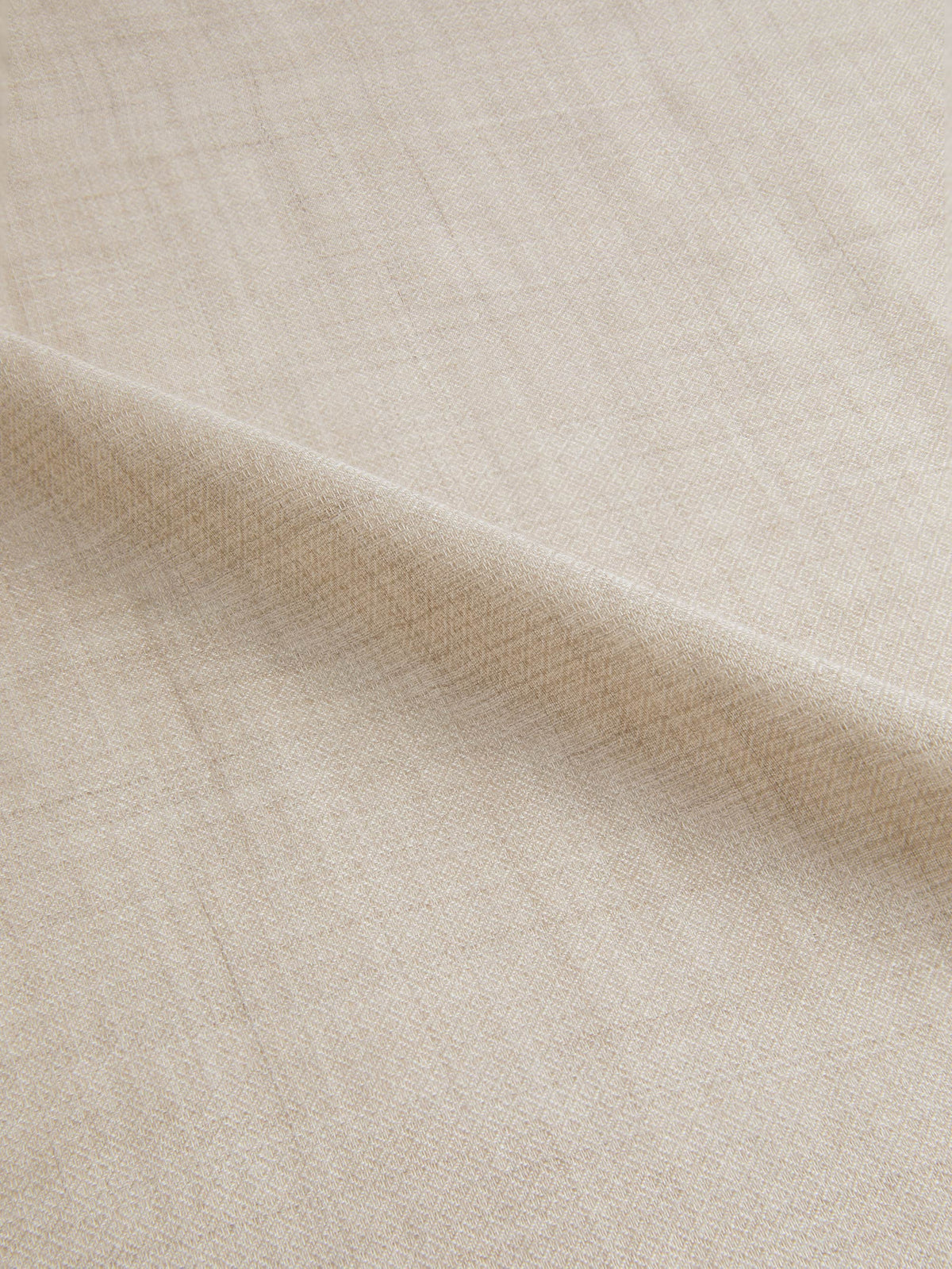 A detailed close-up of the Sand Silk-Cashmere Scarf, showing its intricate micro-diamond weave and soft texture.
