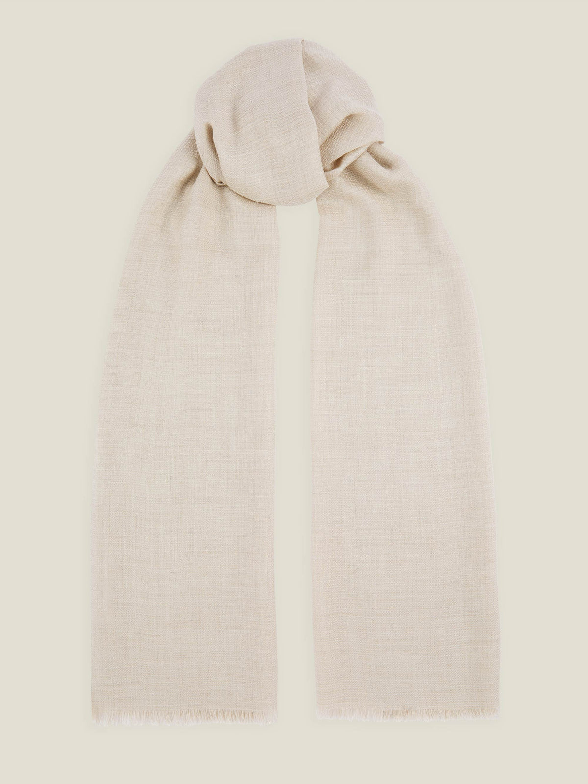 A flat lay of the Luca Faloni Silk-Cashmere Scarf in Sand, tied in a loose knot against a neutral background.