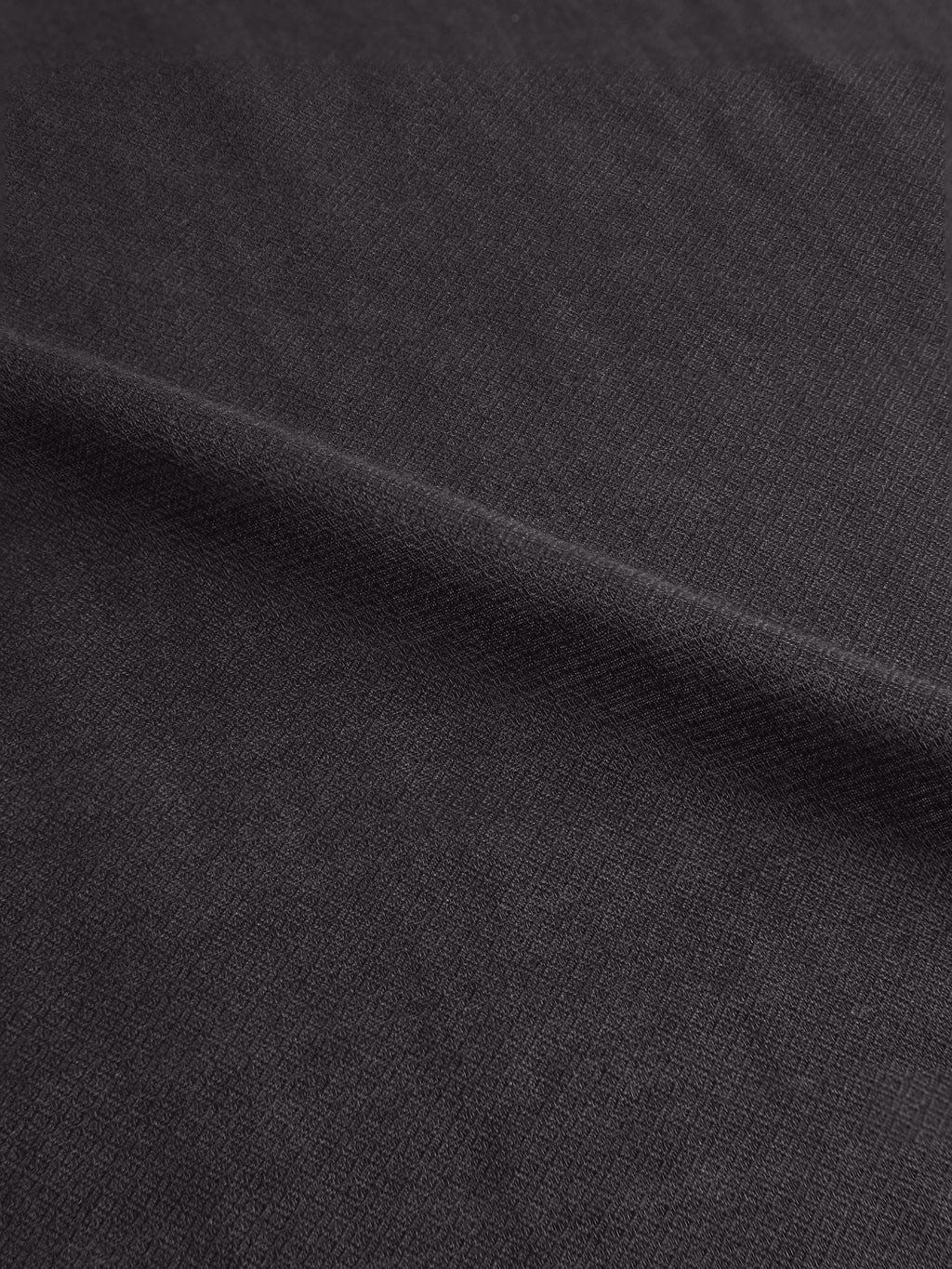 Close-up of the Luca Faloni Silk-Cashmere Scarf in charcoal grey, showing the micro-diamond texture.