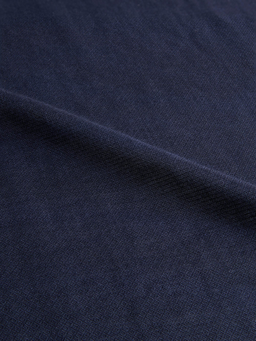 Close-up of the Midnight Blue Silk-Cashmere Scarf, showcasing the detailed micro-diamond texture of the fabric.